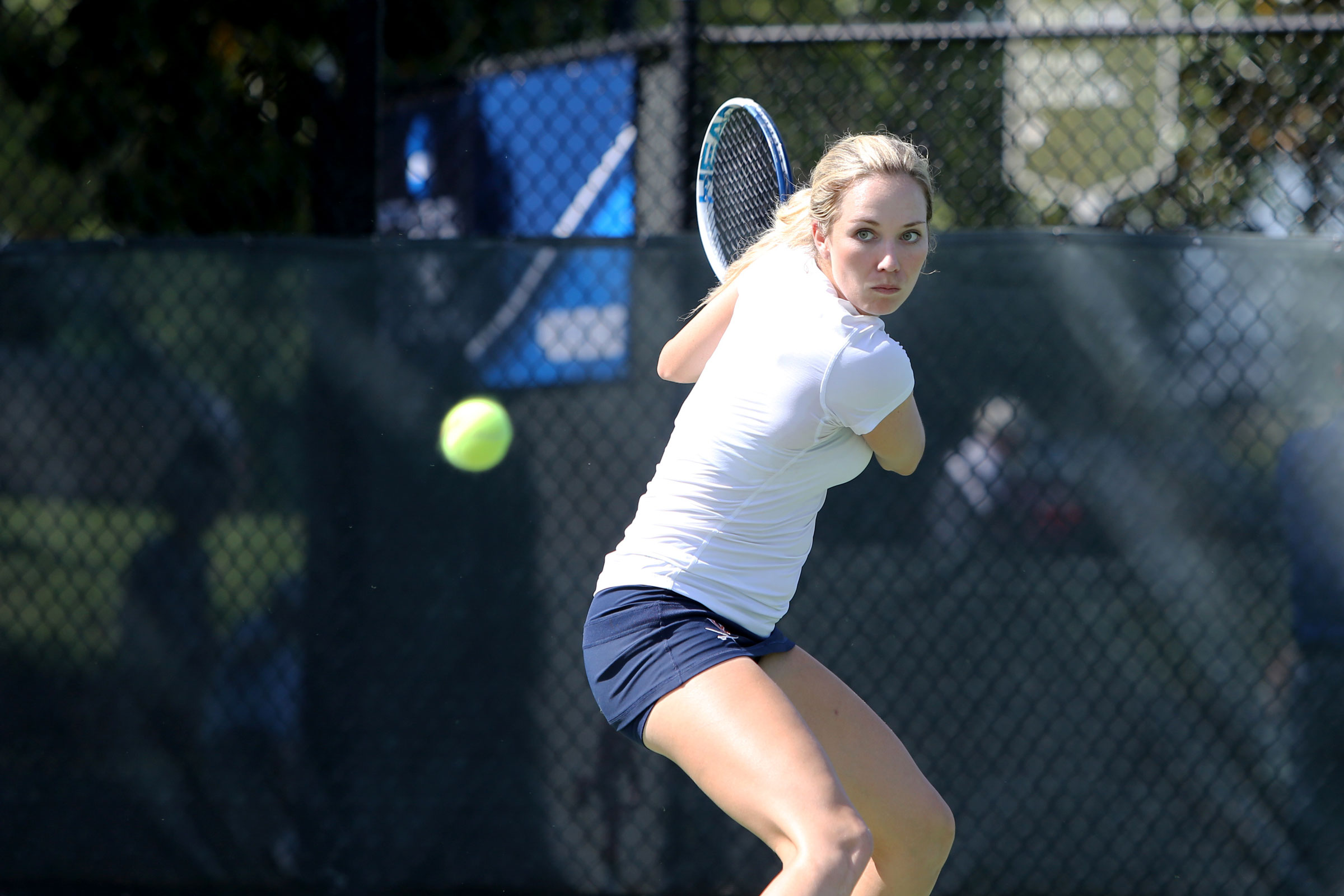 Candid photo of Collins in action during a tennis match.