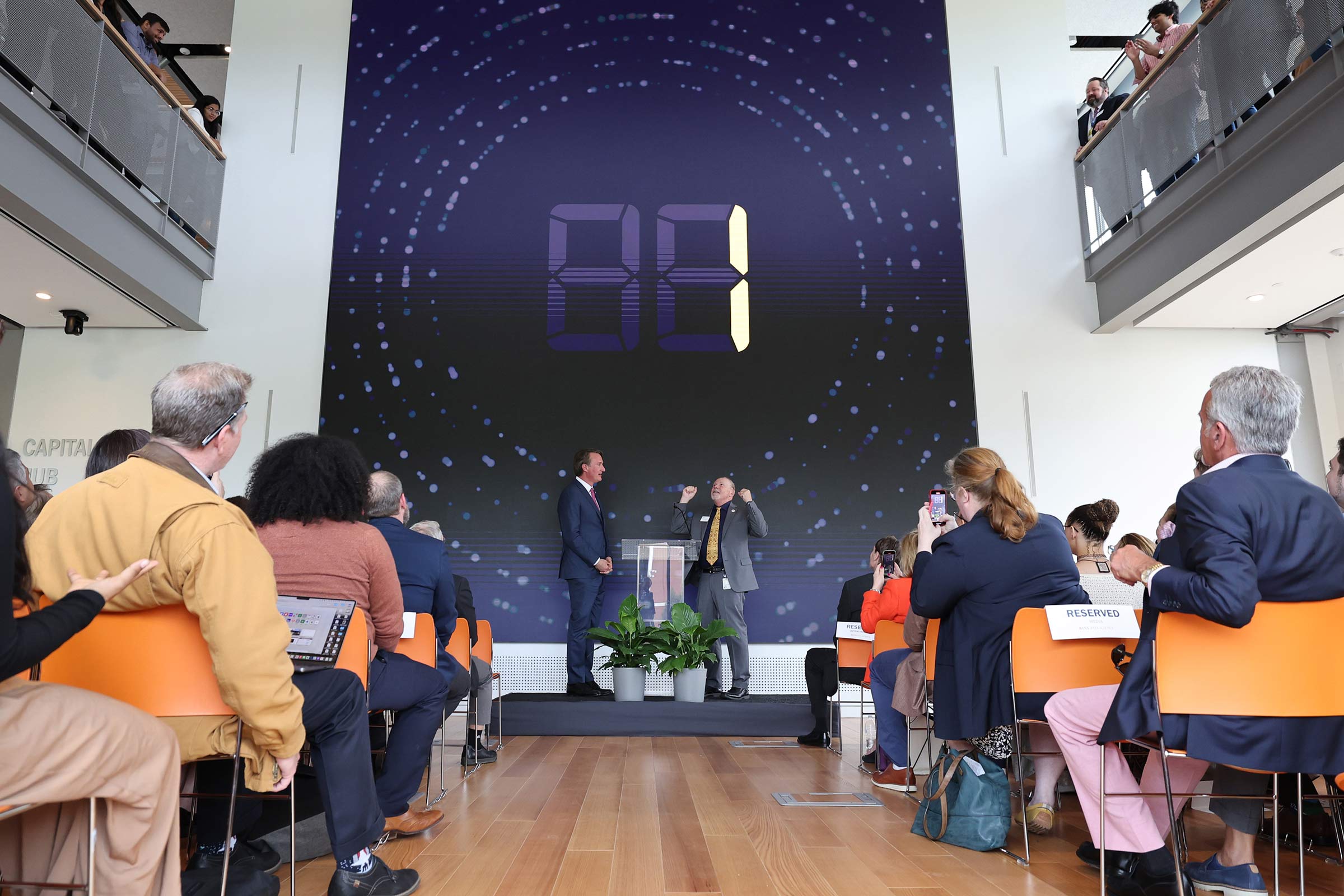 Youngkin, left, and School of Data Science Dean Phil Bourne count along with a digital countdown to the building’s official opening. 