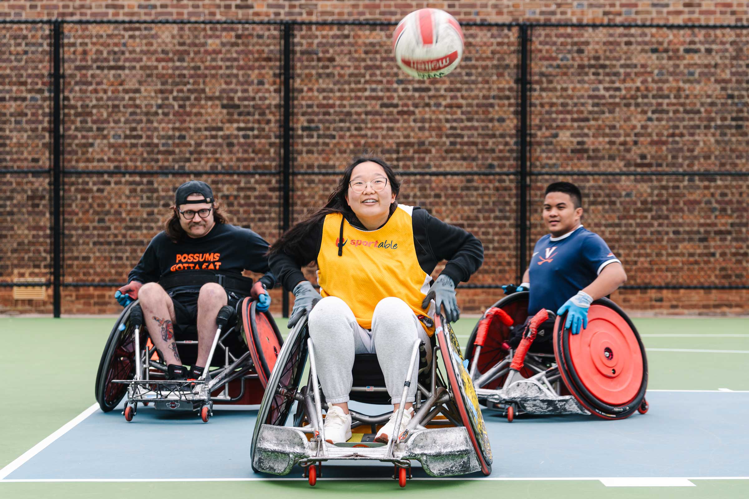 Individuals with disabilities playing wheelchair basketball.