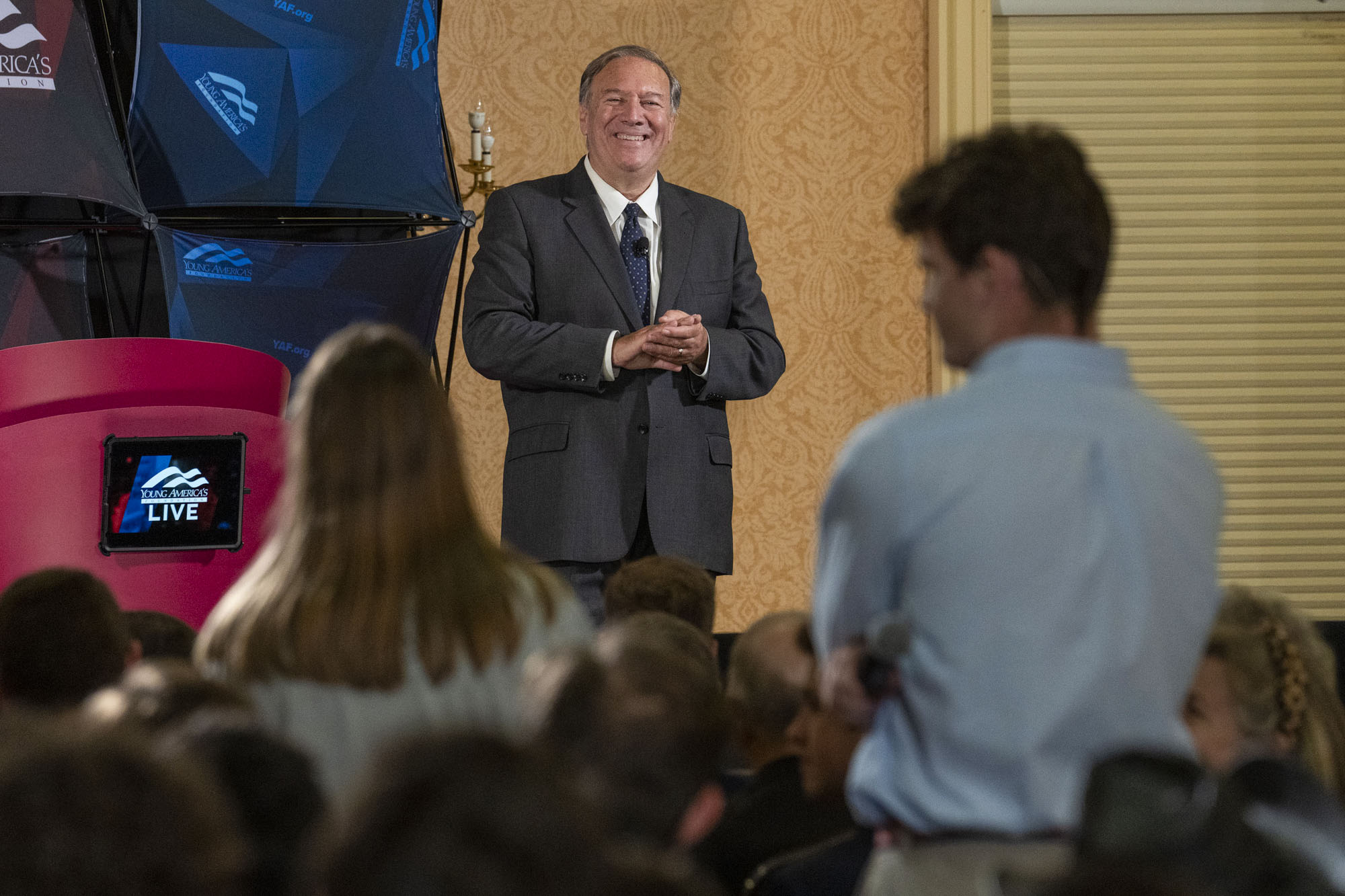 Mike Pompeo smiles at student