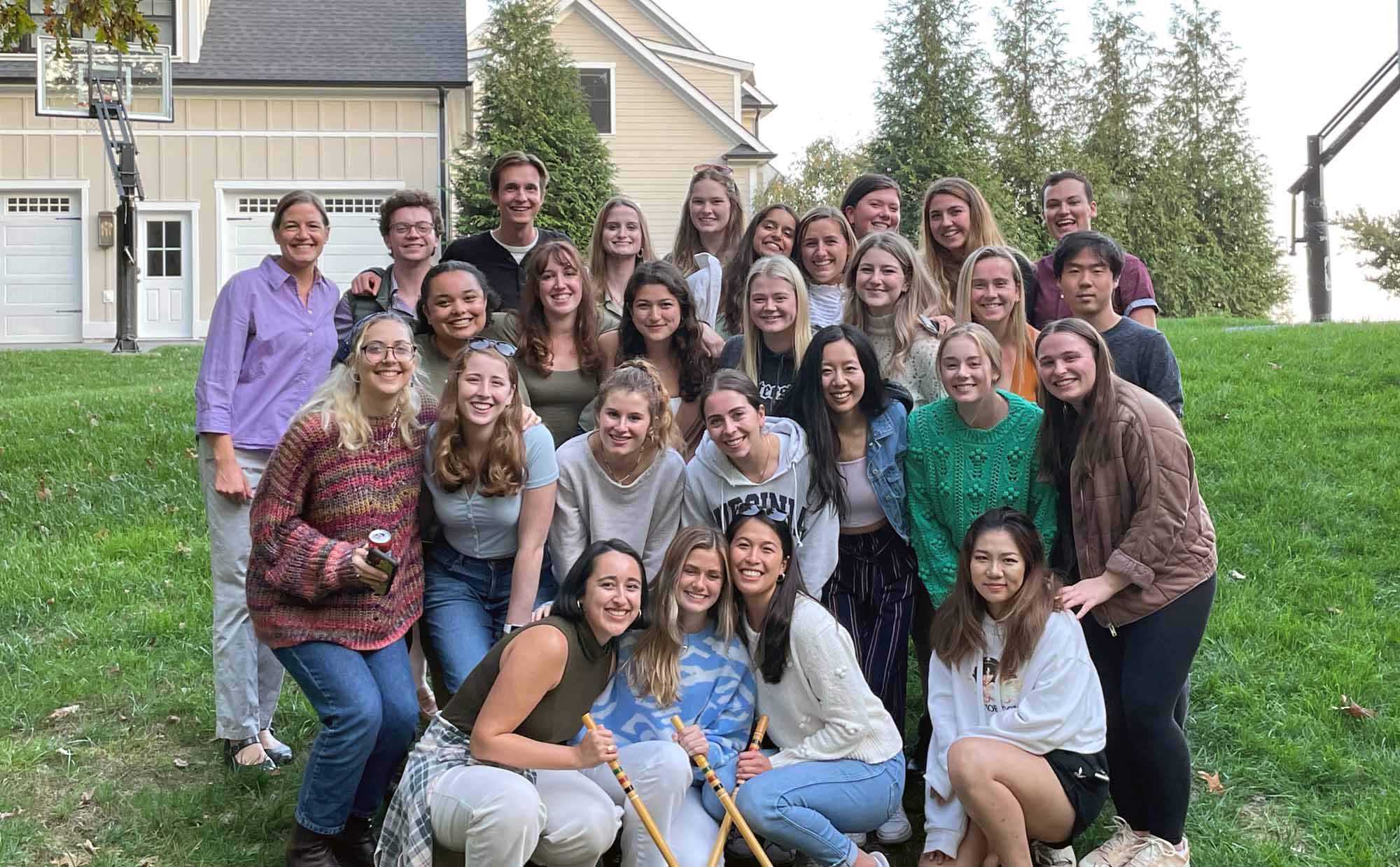 Group portrait of Carrie Heilman gathered with many of her students