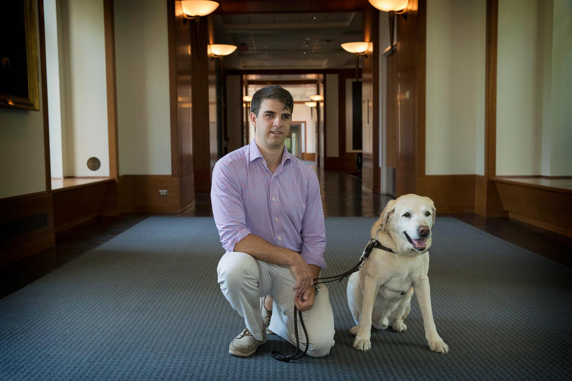 Portrait of Simpson and his former guide dog, Lacrosse.