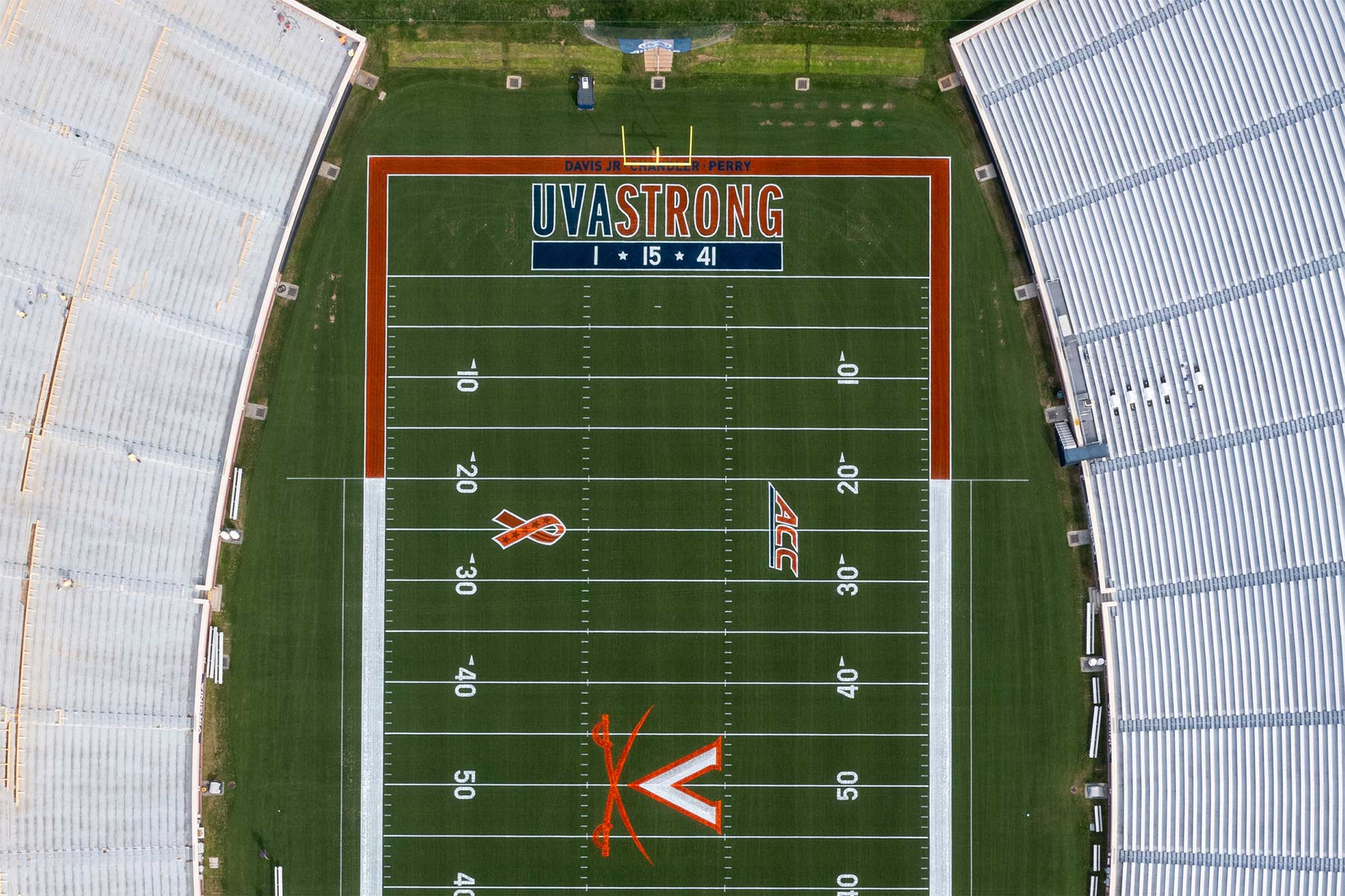 Aerial of Scott Stadium showing the UVA Strong logo, the players’ names and numbers painted in the end zone