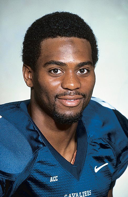 A young Dorsey wears a football jersey and smiles for the camera