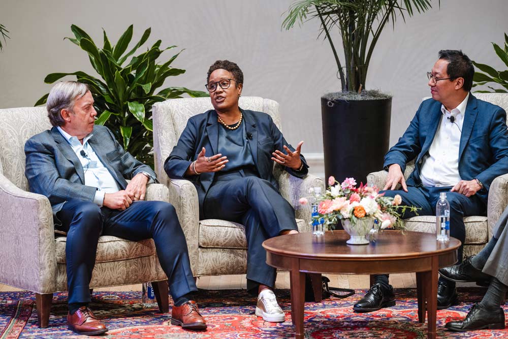 Candid portrait of Harriet Nembhard, President of Harvey Mudd College, with other panel members.