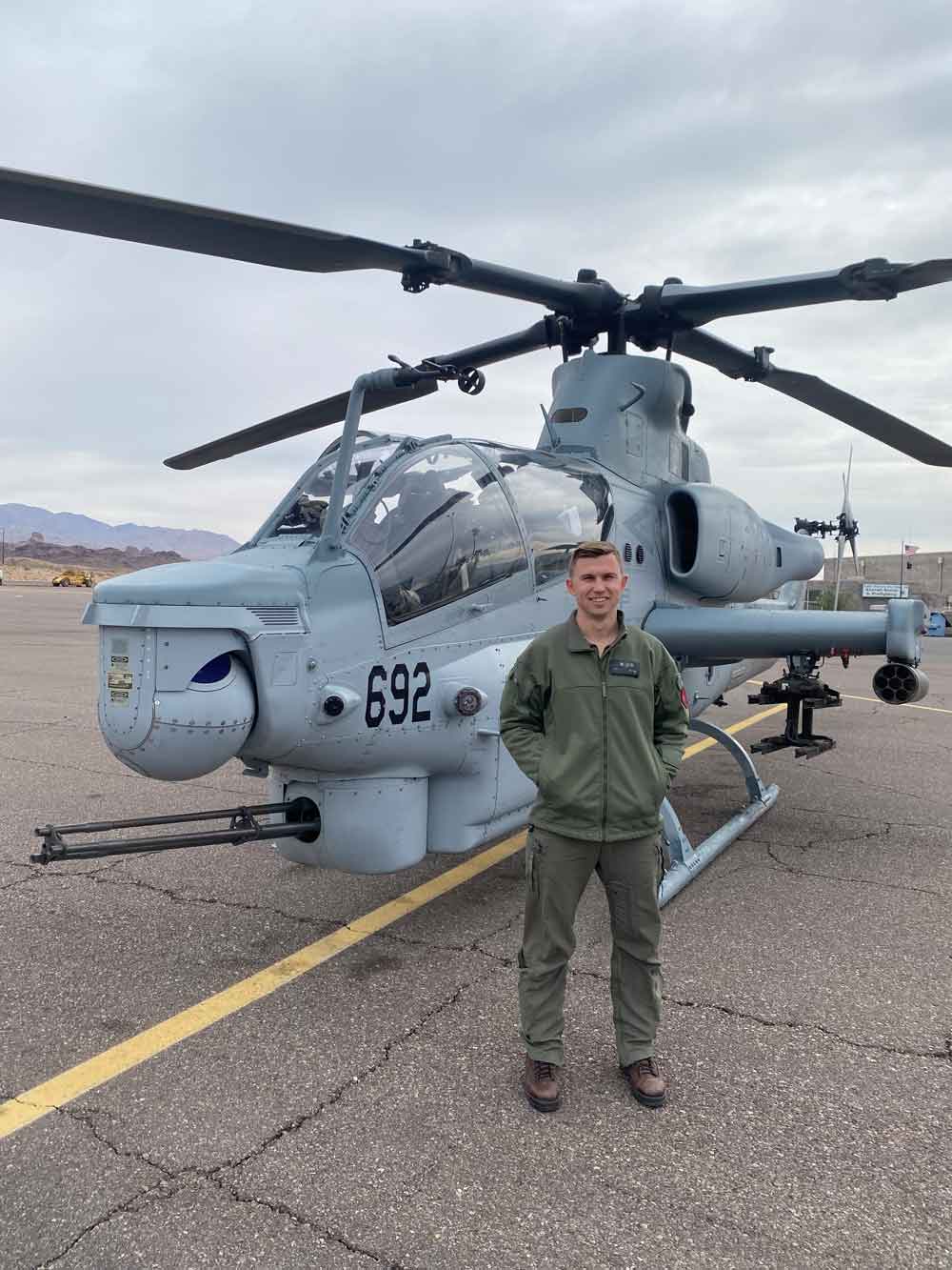 Matt Ganyard in front of a cobra helicopter