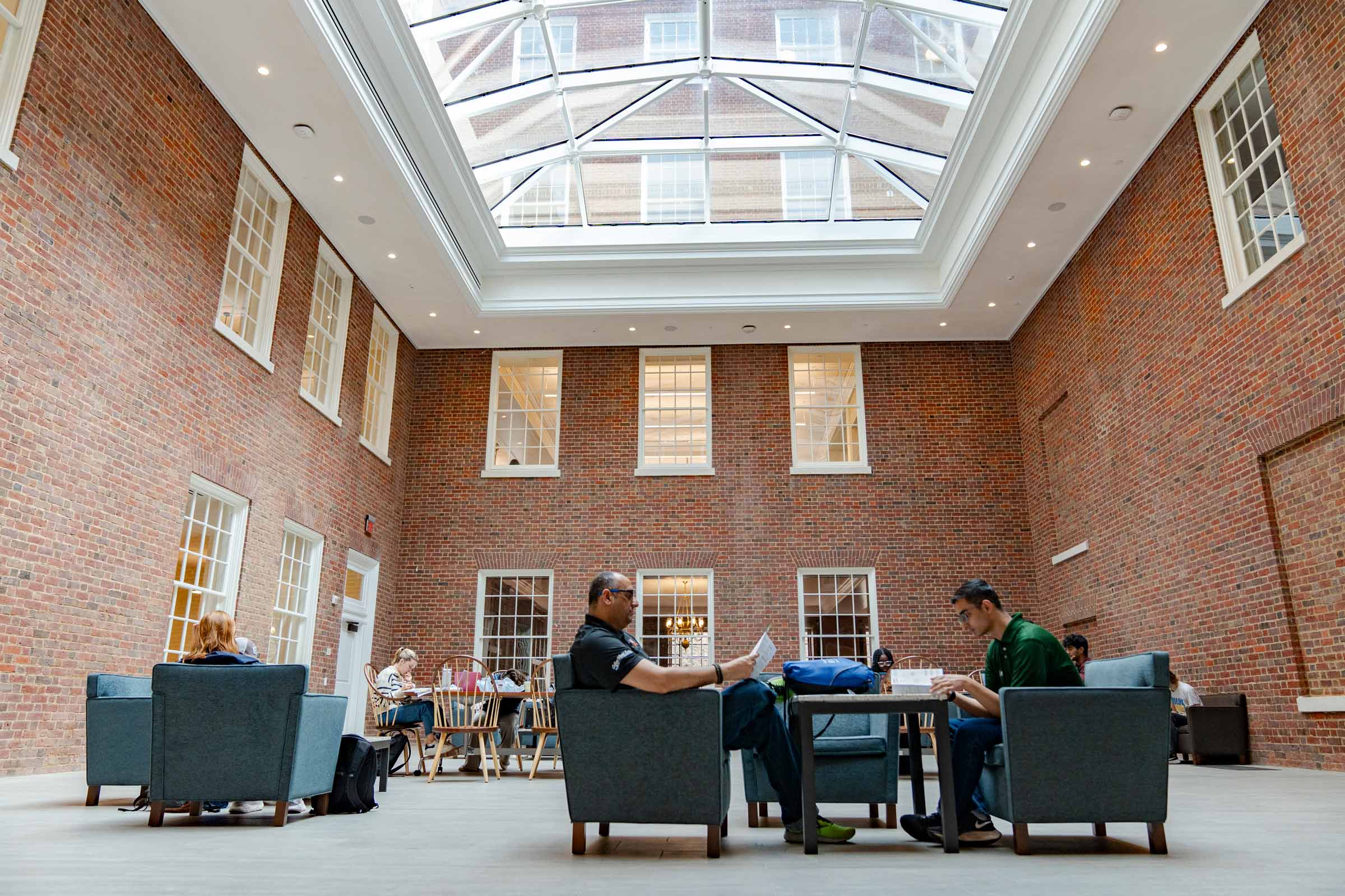 An interior shot of a glass roofed study area in the Edgar Shannon Library