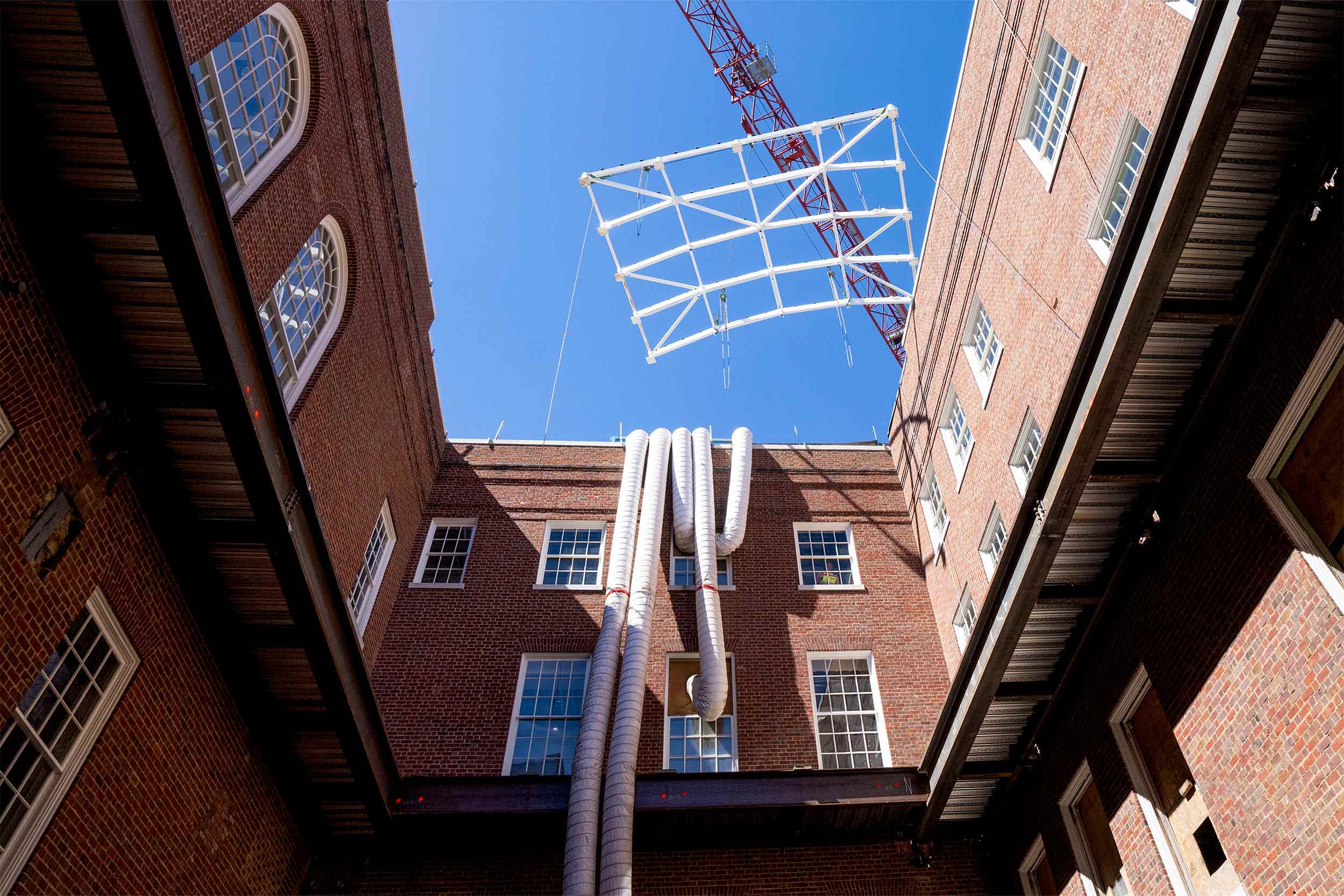 A frame is lowered into the library courtyard