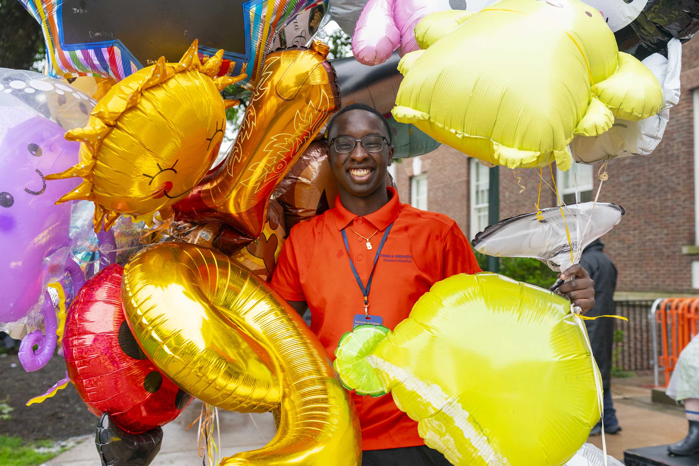 Rising fourth-year student Taryk Saidou was all smiles as he collected balloons. 