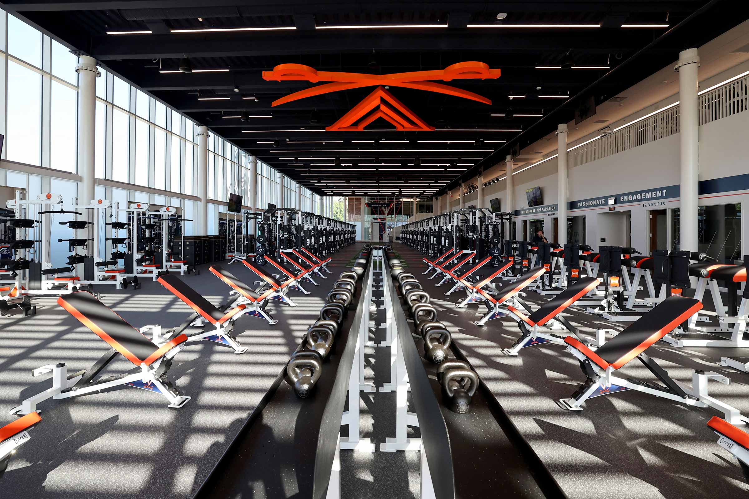 Rows of weight lifting benches and machines line the facility
