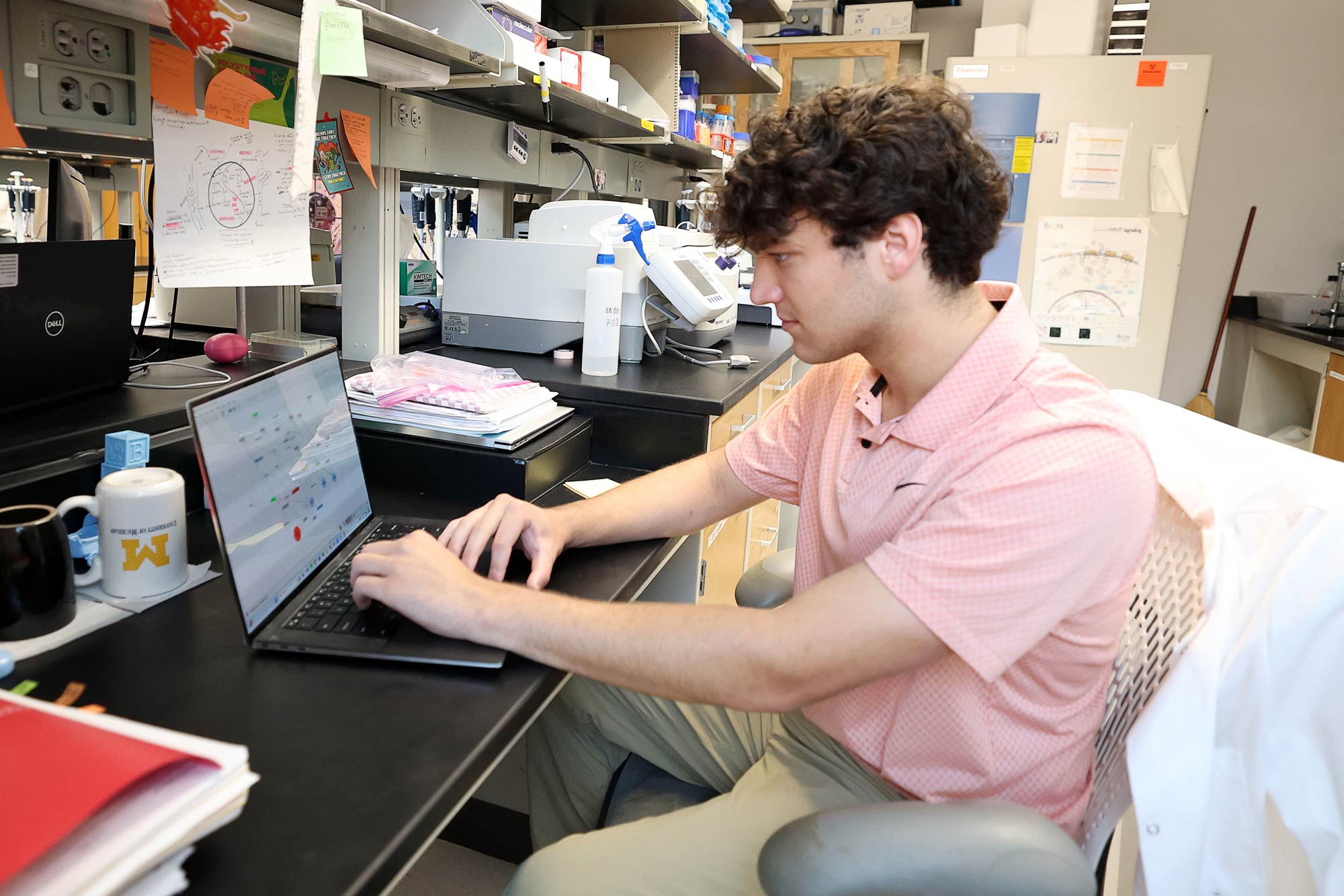 Graham Lenert working in a lab