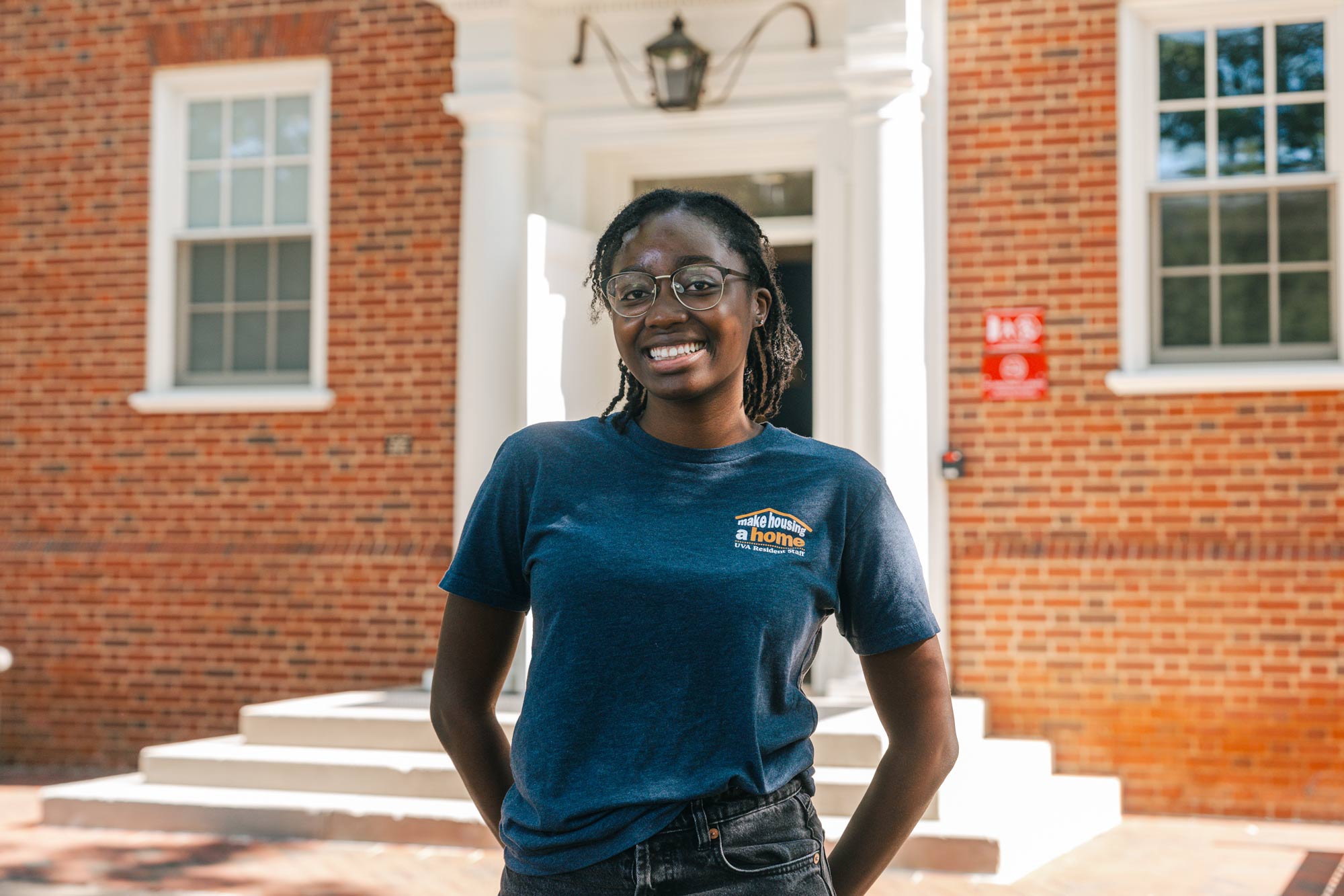 Ida Doucoure in front of Housing and Residence Life building