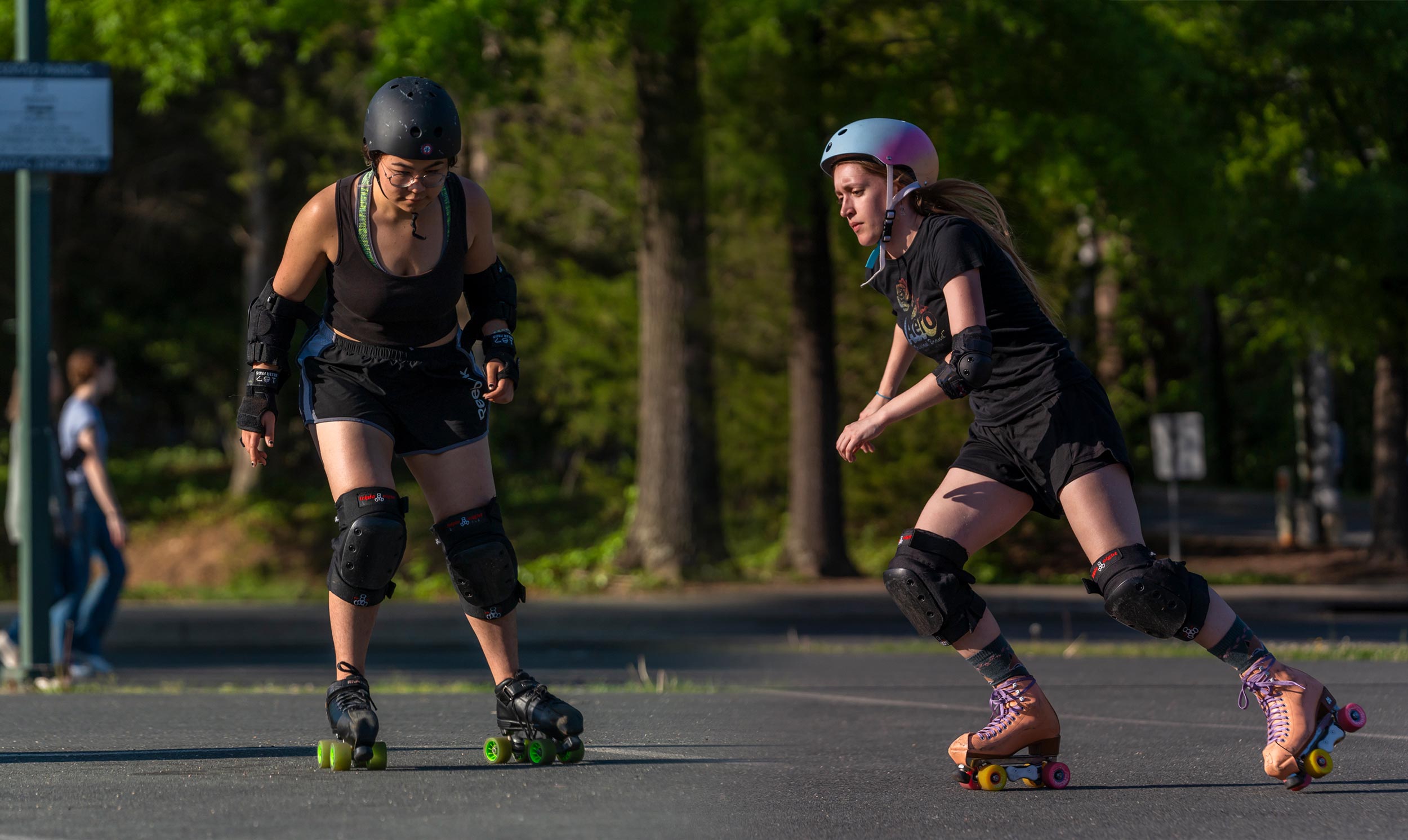 Two skaters in motion during a roller derby drill