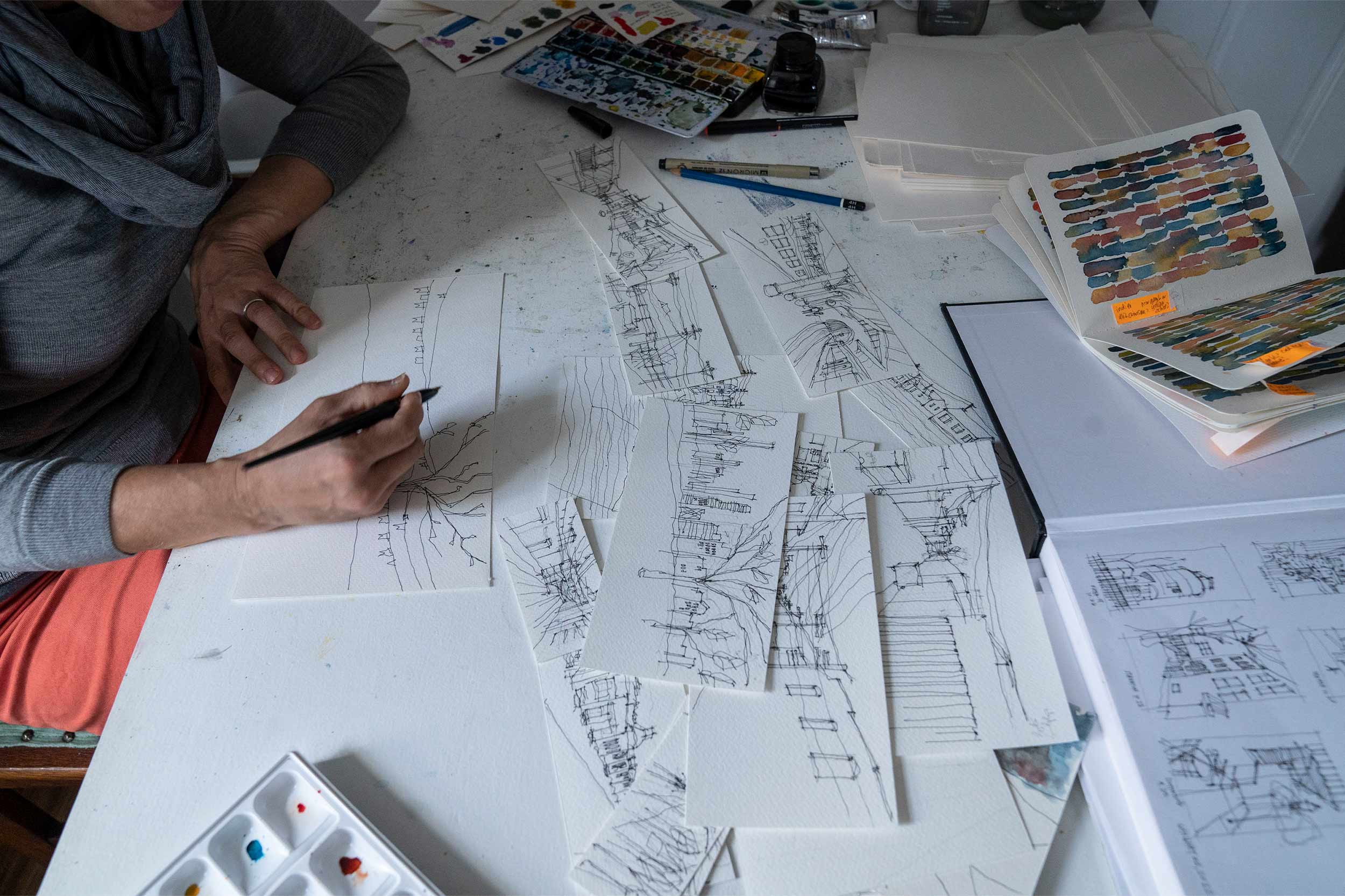 Close up of Trimble's desk covered in sketches