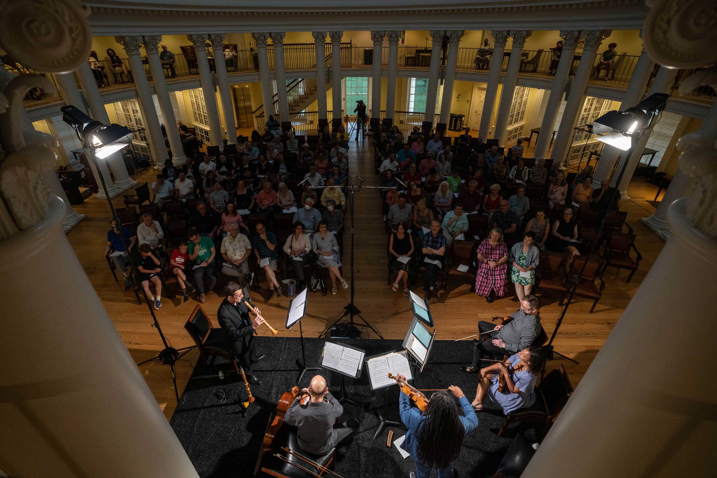 A view from above and behind the musicians facing the crowd in the Dome Room