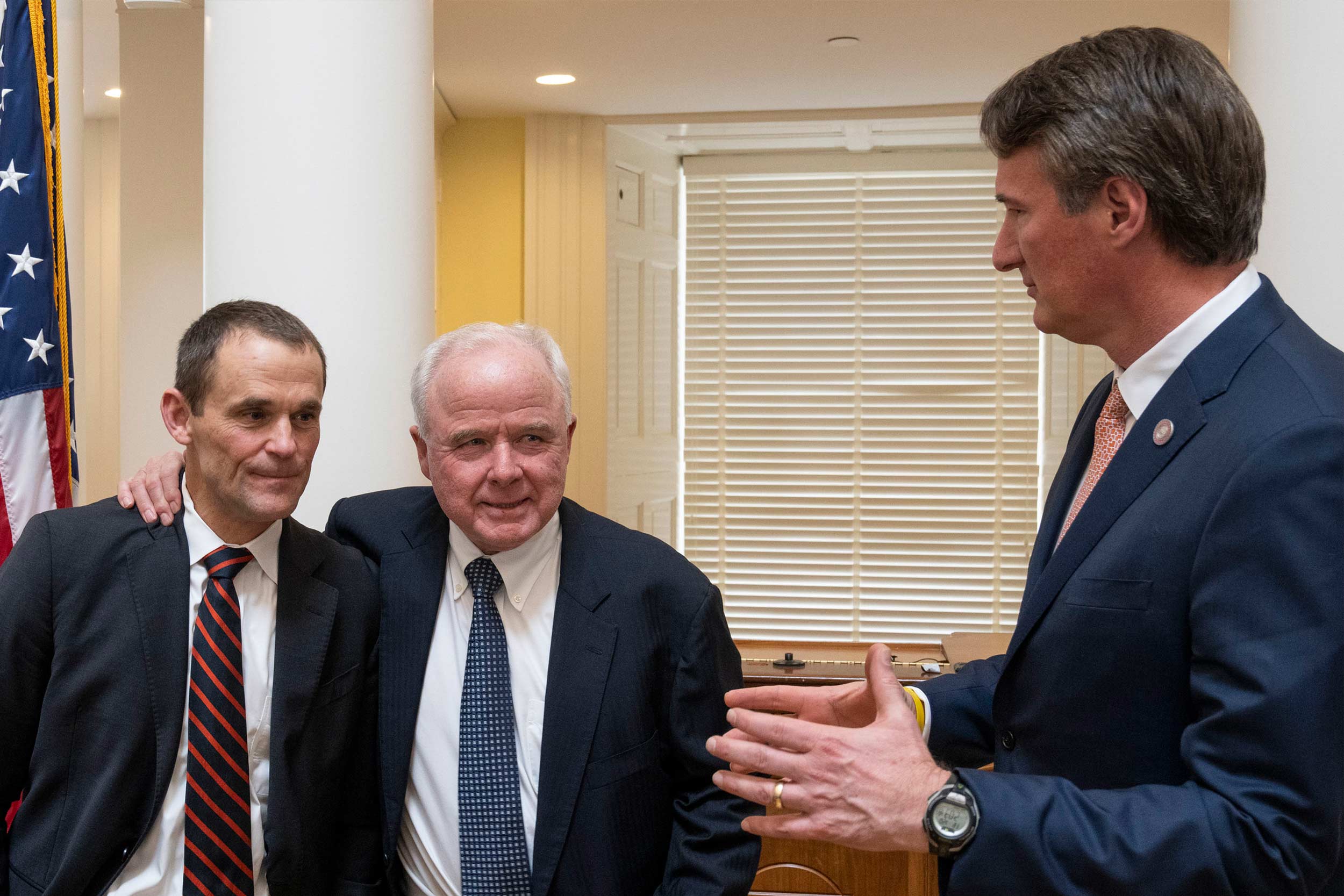 President Jim Ryan, Paul Manning and Gov. Glenn Youngkin talking together