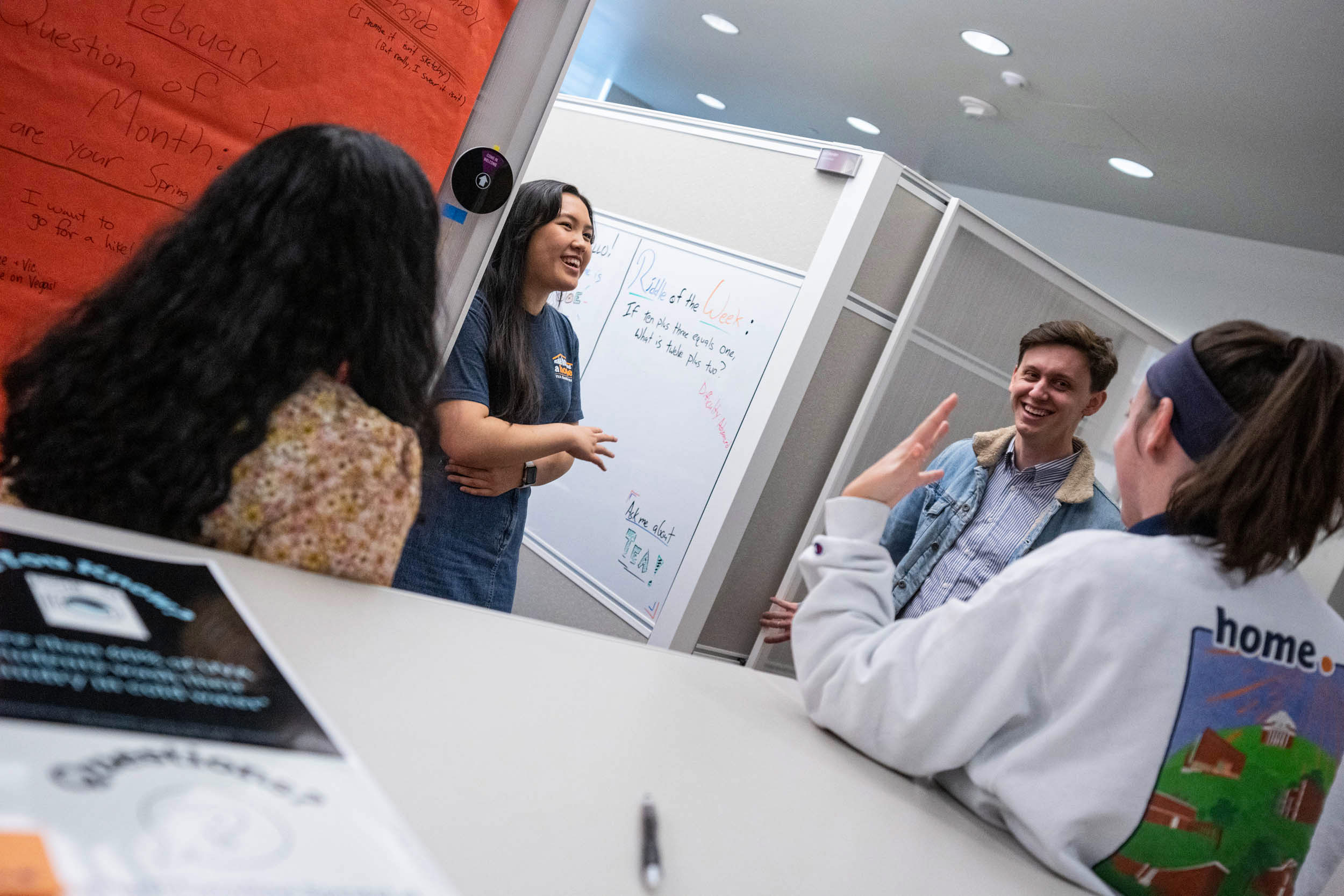 Ng shares a laugh with colleagues in UVA Housing & Residence