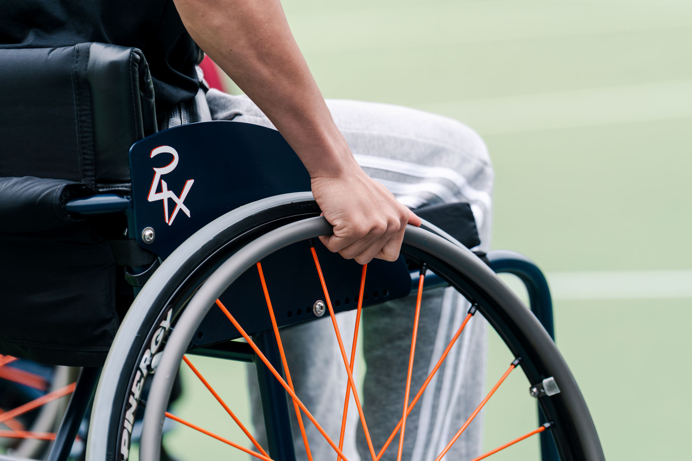 Side view picture of an individual in a wheelchair.