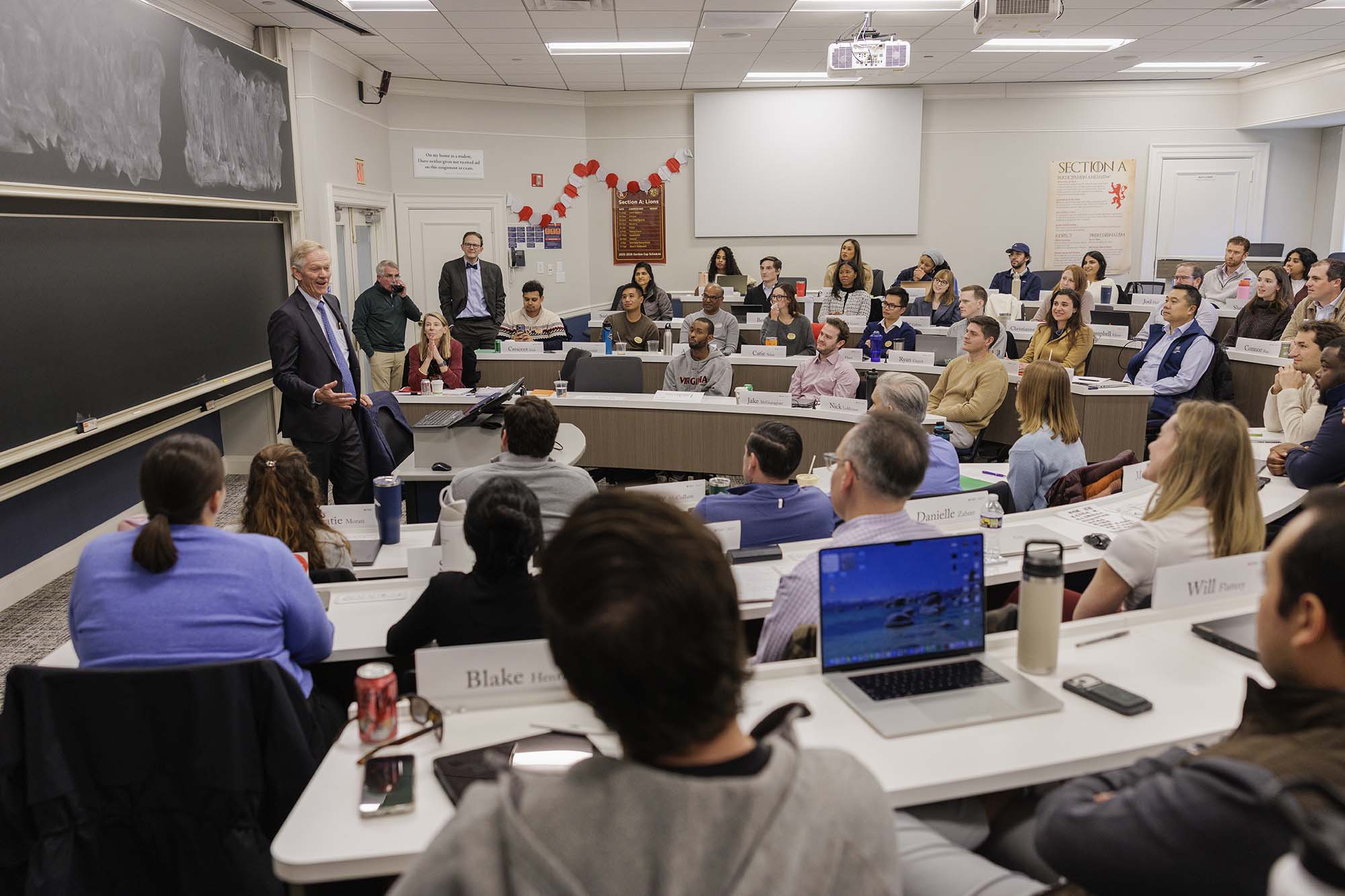 Beardsley speaking to students in a lecture hall at the UVA Darden School of Business