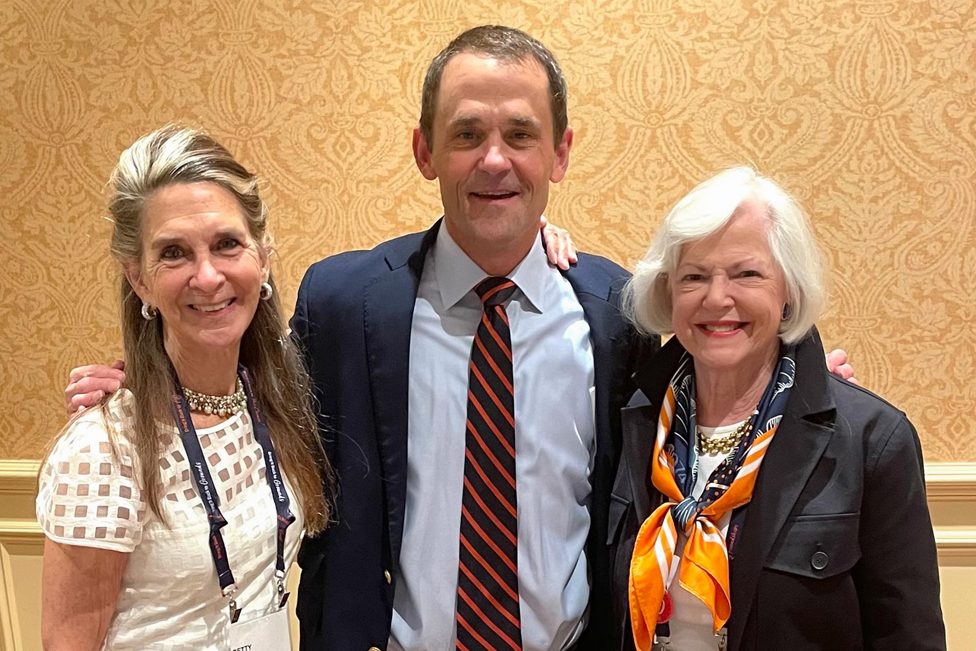 Shotton, left, and Brown, right, pose with University President Jim Ryan 