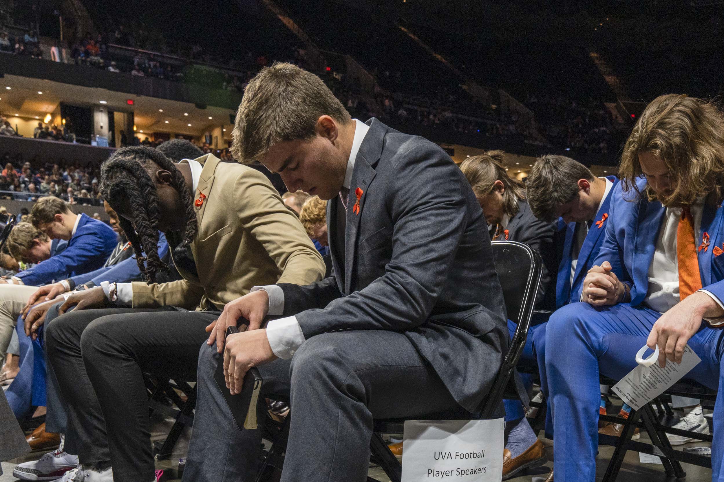Football players mourning together