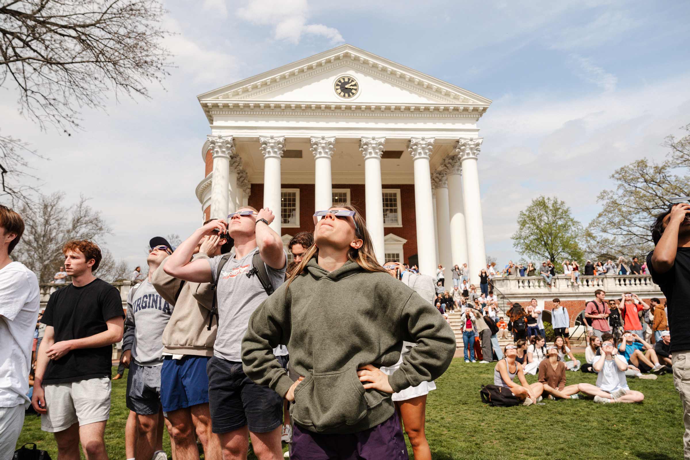 A group looks at Eclipse in front of Rotunda
