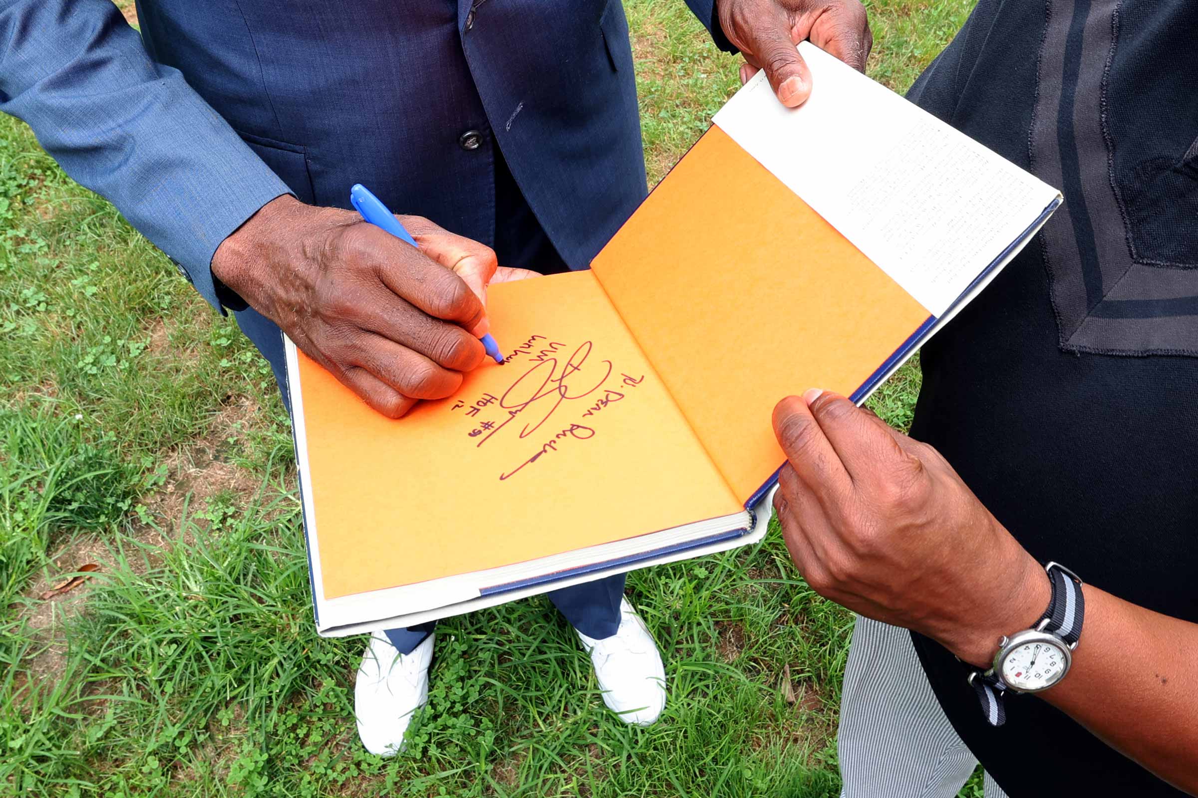 Sampson signing Rucker's book