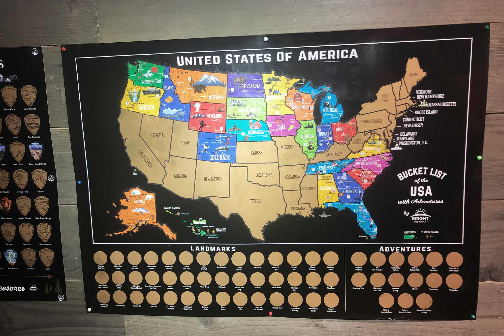 A map of the United States with gold paint scratched off to reveal color states that Pleško has visited. 