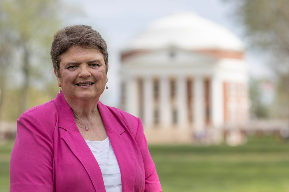 Vickie Southall smiles for a portrait in front of the Rotunda