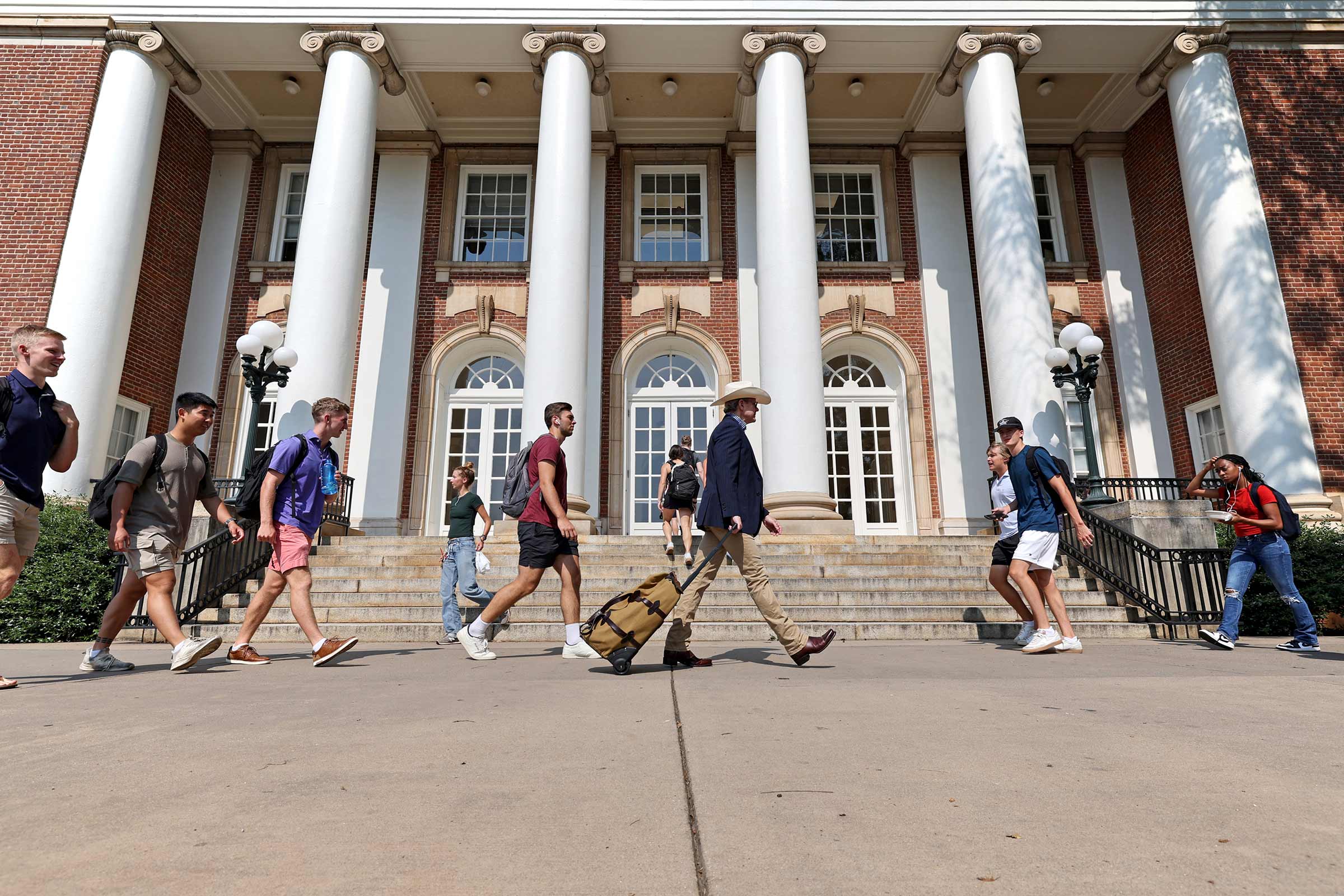 Portrait of first day of classes with students walking to their classrooms