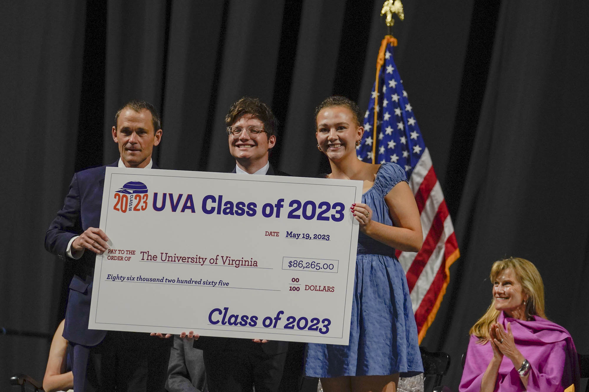 Jom Ryan accepting the Class of 2023 donation check from Ethan B. Fingerhut and Hannah L. Herzog