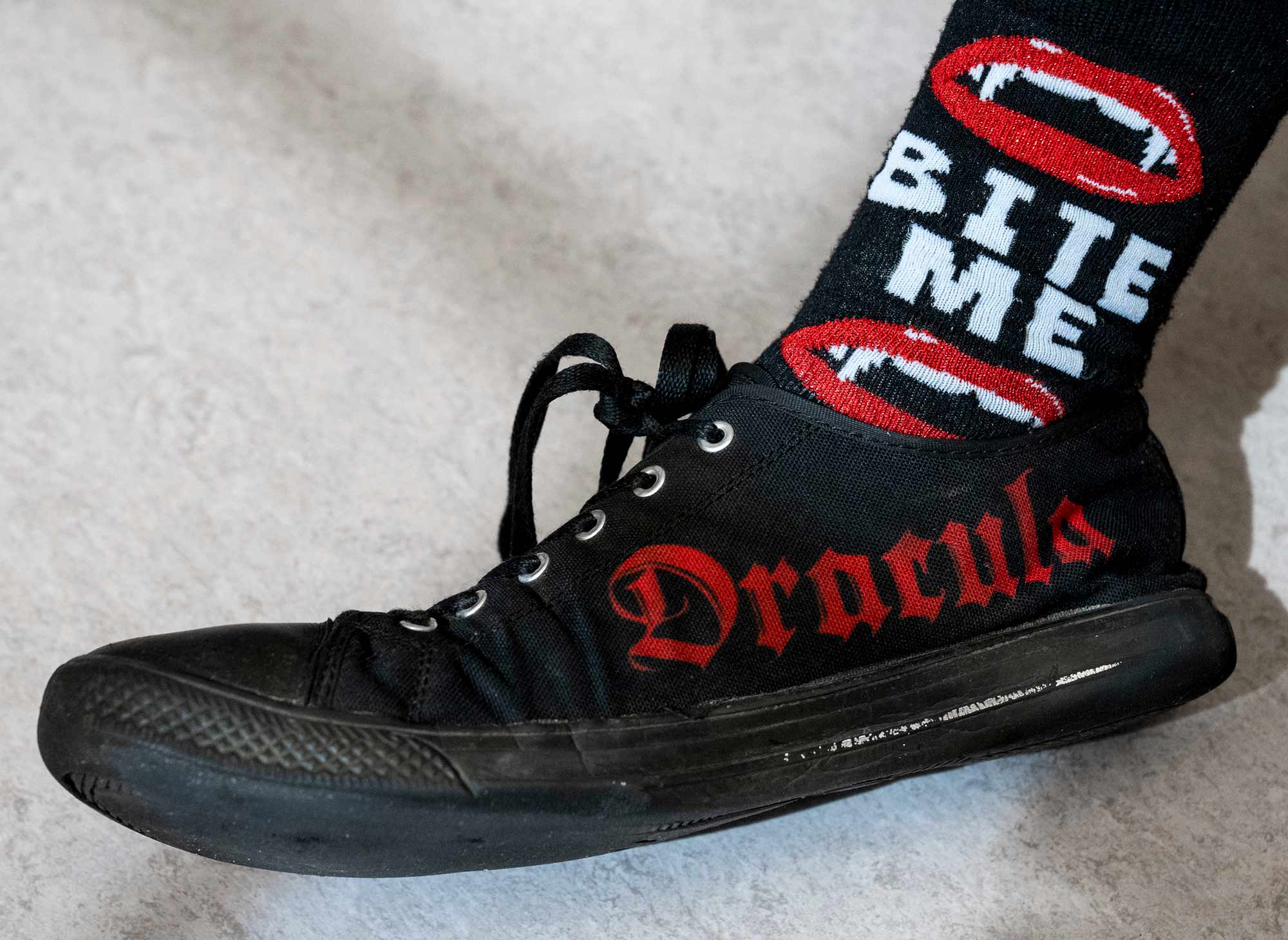 Bite Me fanged socks with Dracula sneakers