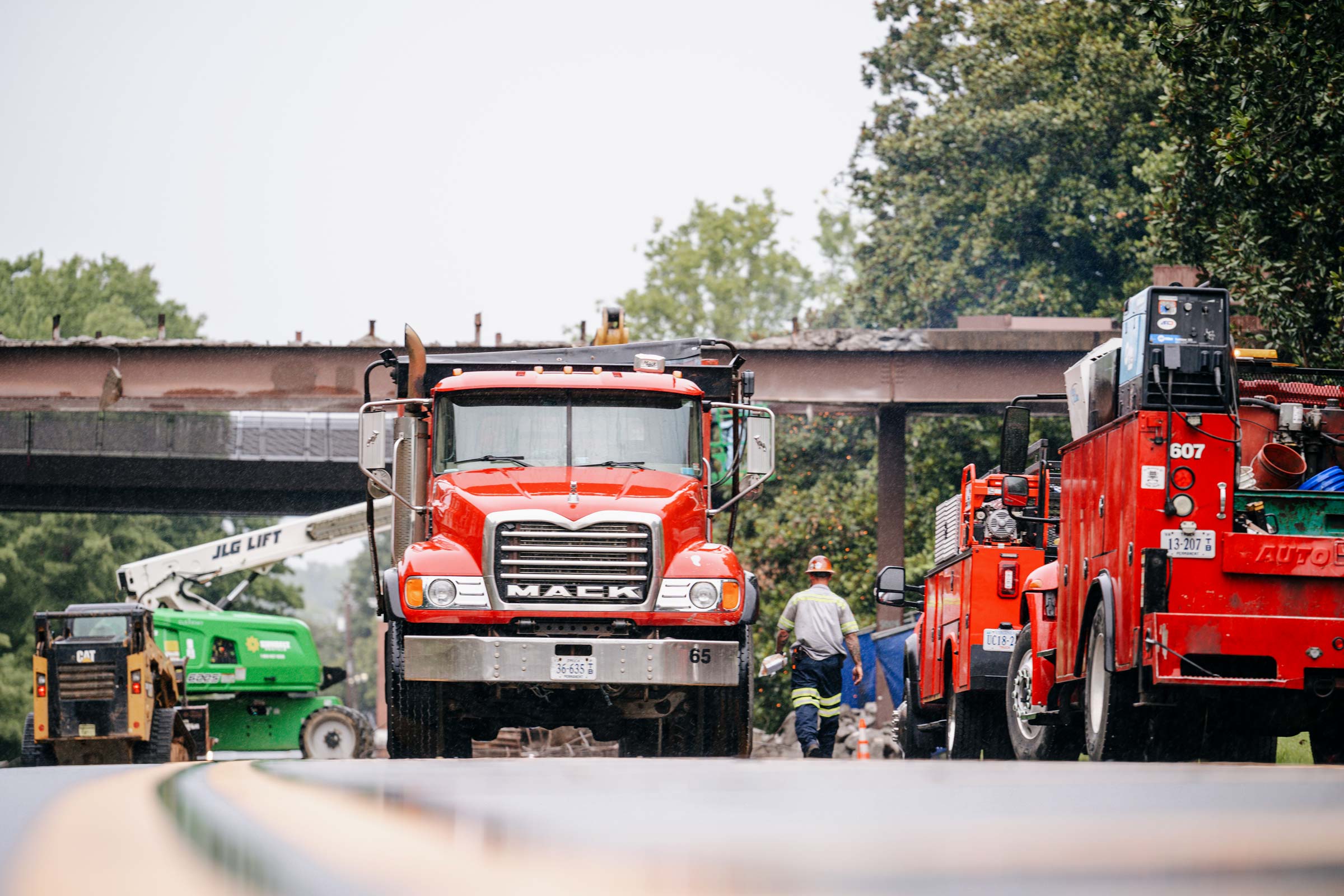 Construction site with few Dump trucks.