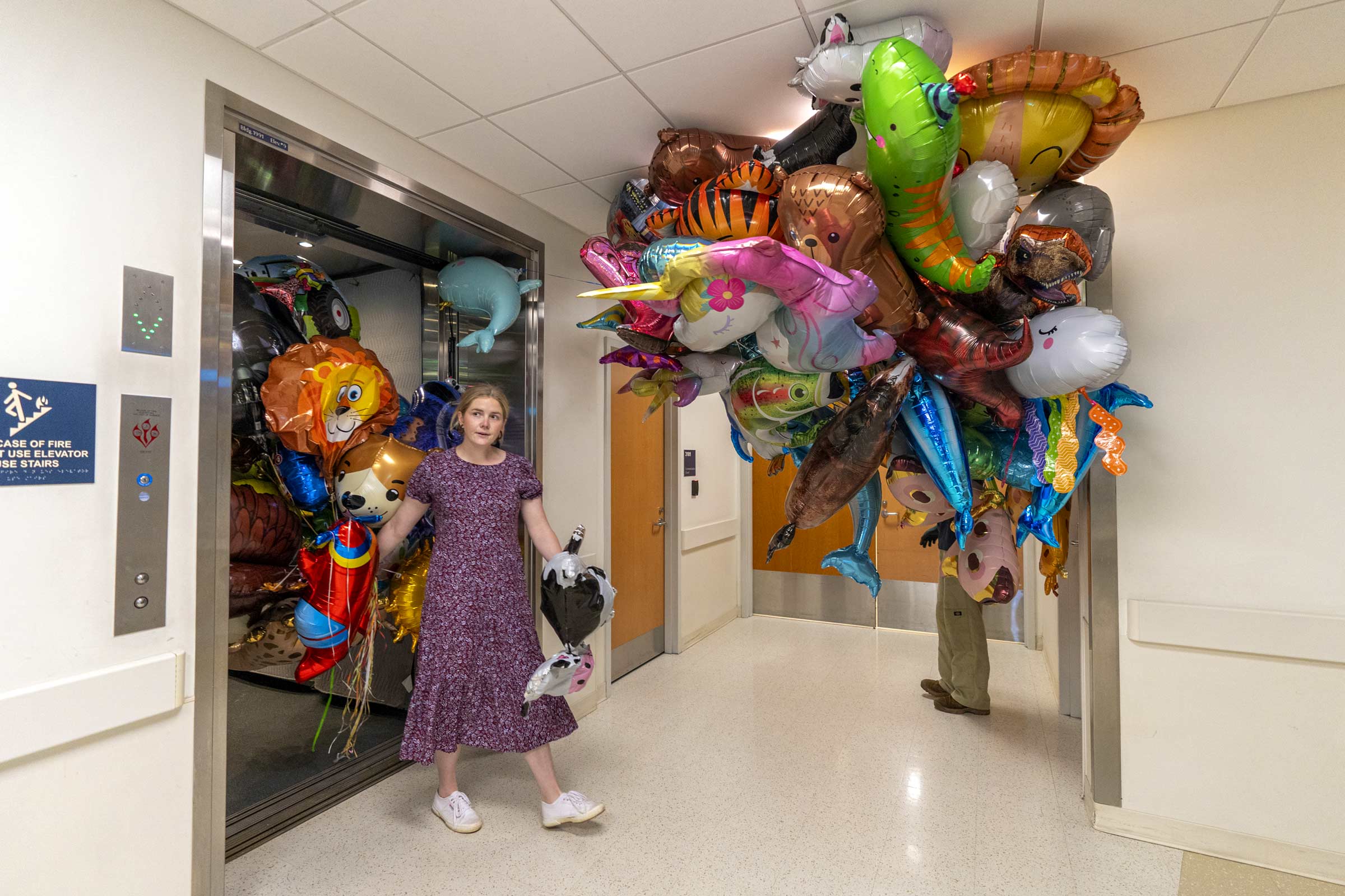 Lela Garner, student outreach and engagement manager for UVA Sustainability, helps deliver the balloons collected during Finals Weekend. 