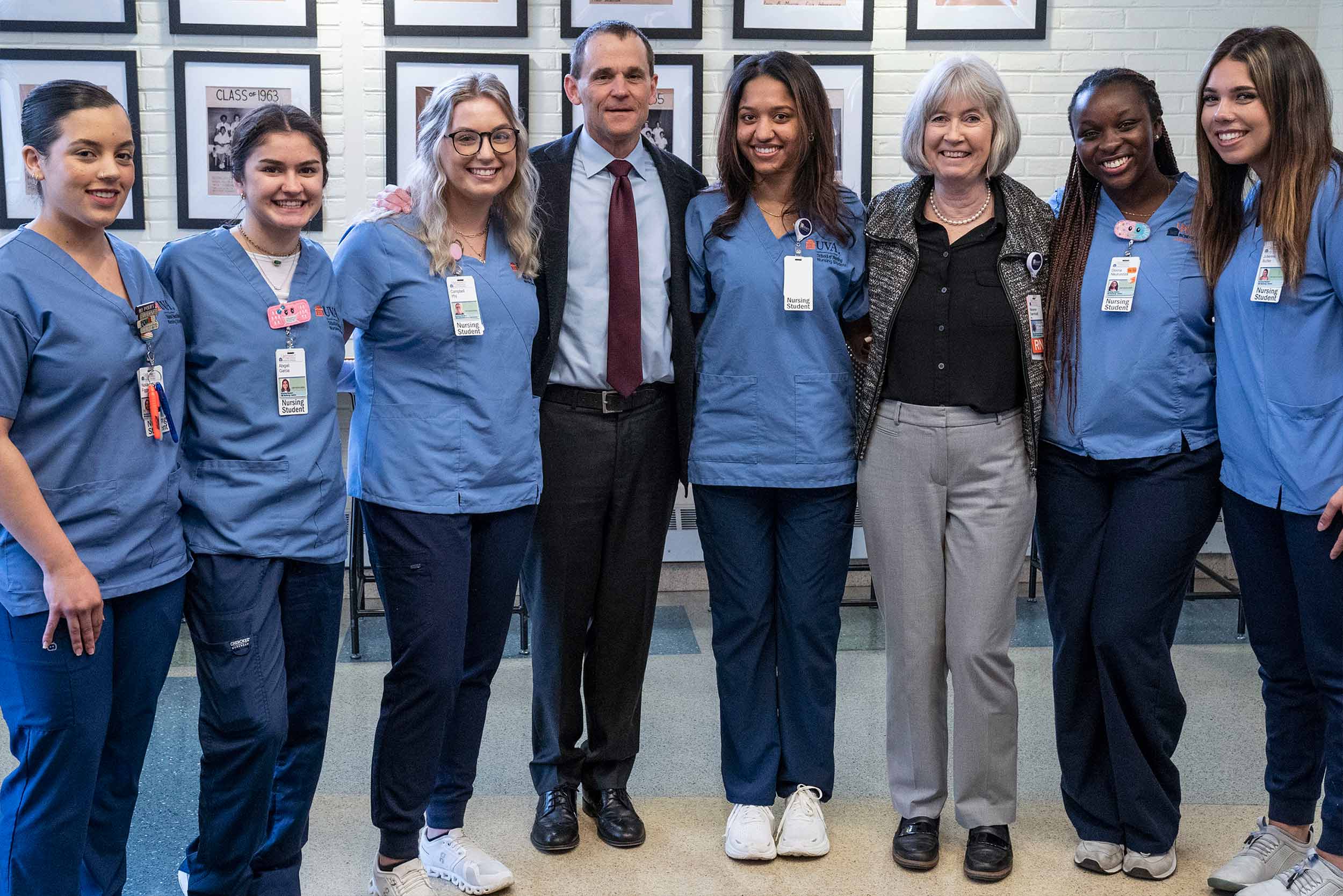 Group photo of President Ryan, Dean Baernholdt, and the nursing students presenting