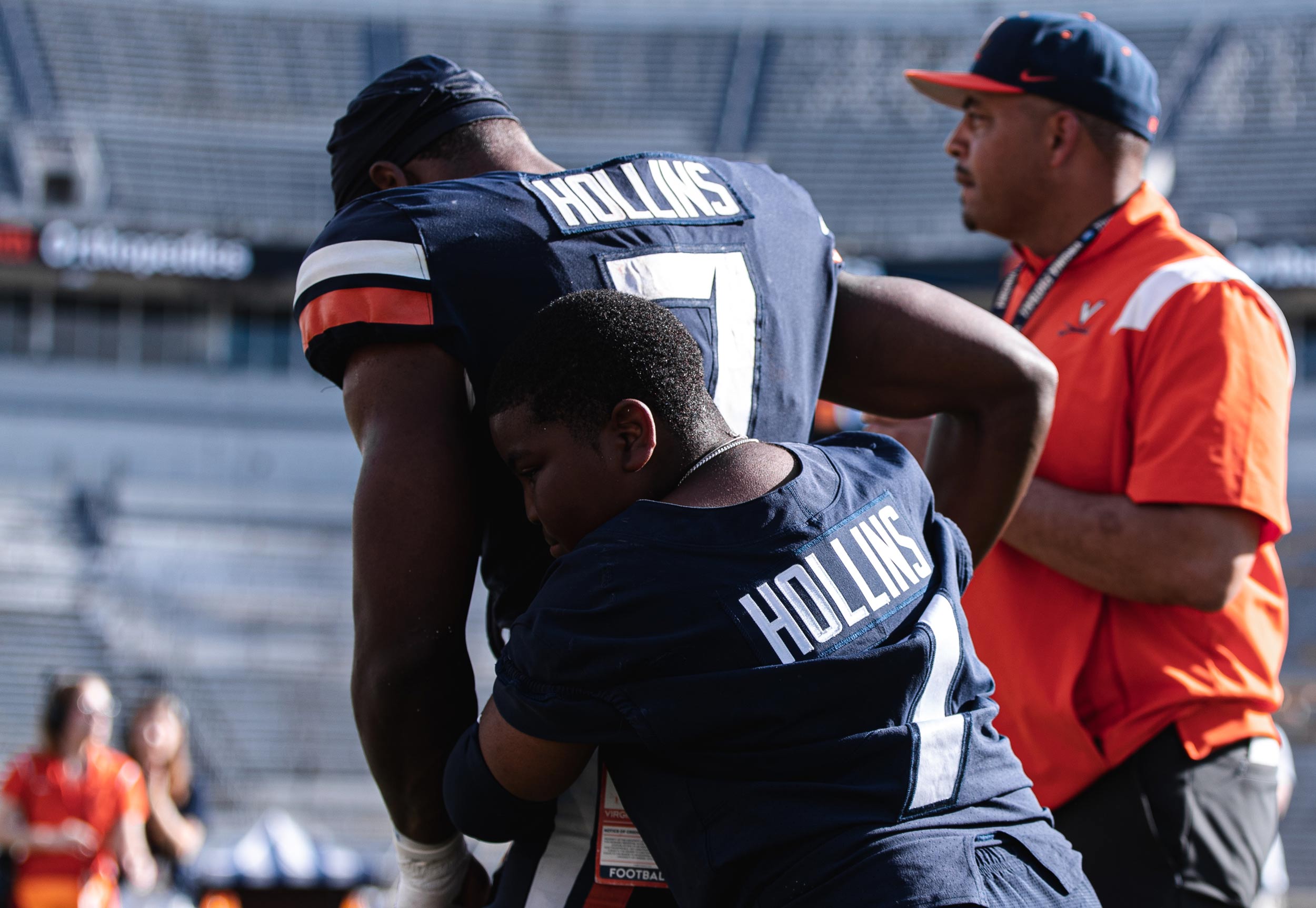 Hollins recieves an on field hug from his little brother