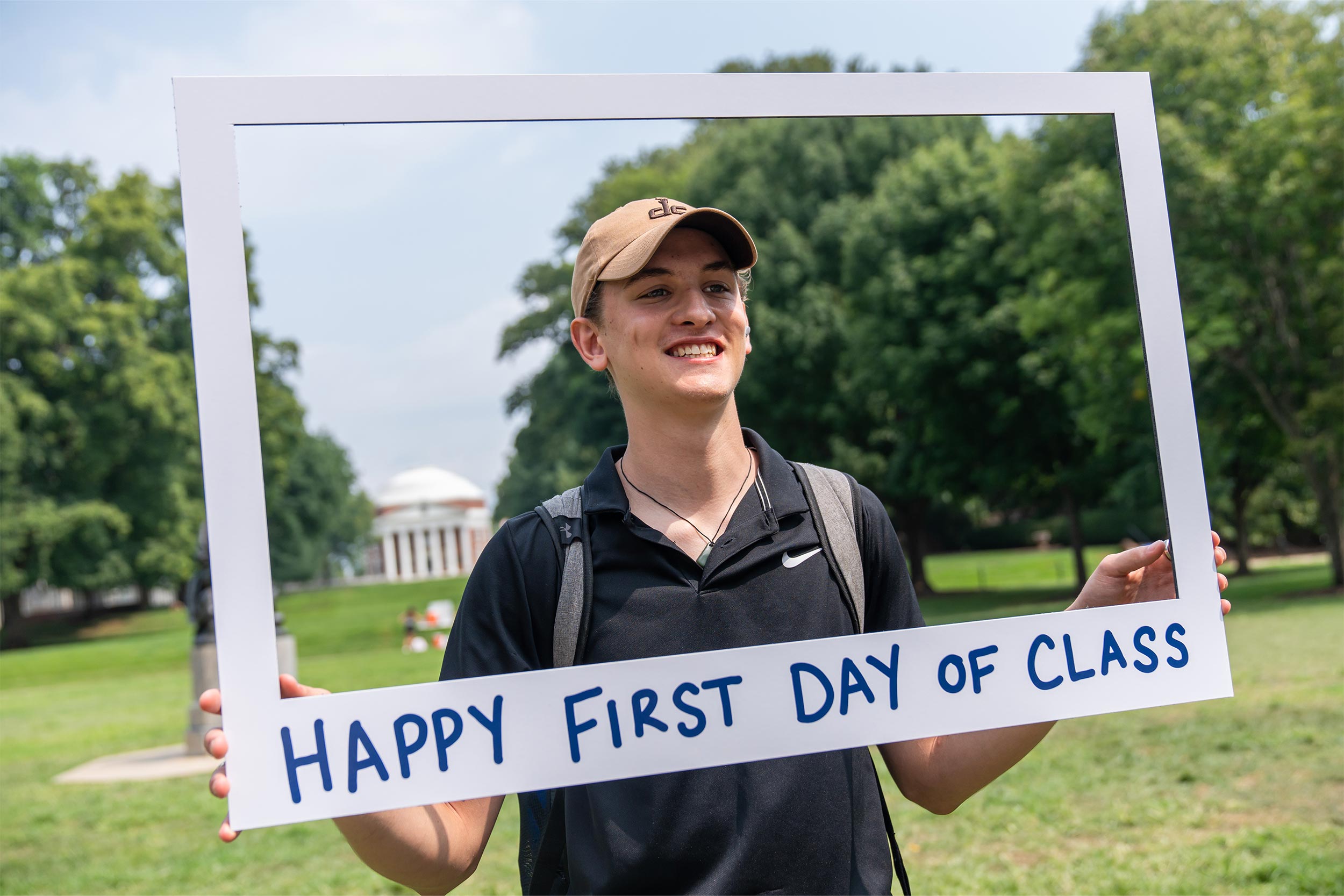 student poses happily on first day of school