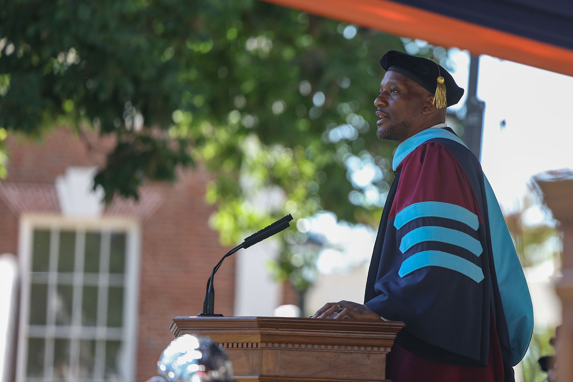 Kenyan Bonner in regalia addressing the crowd on the Lawn.