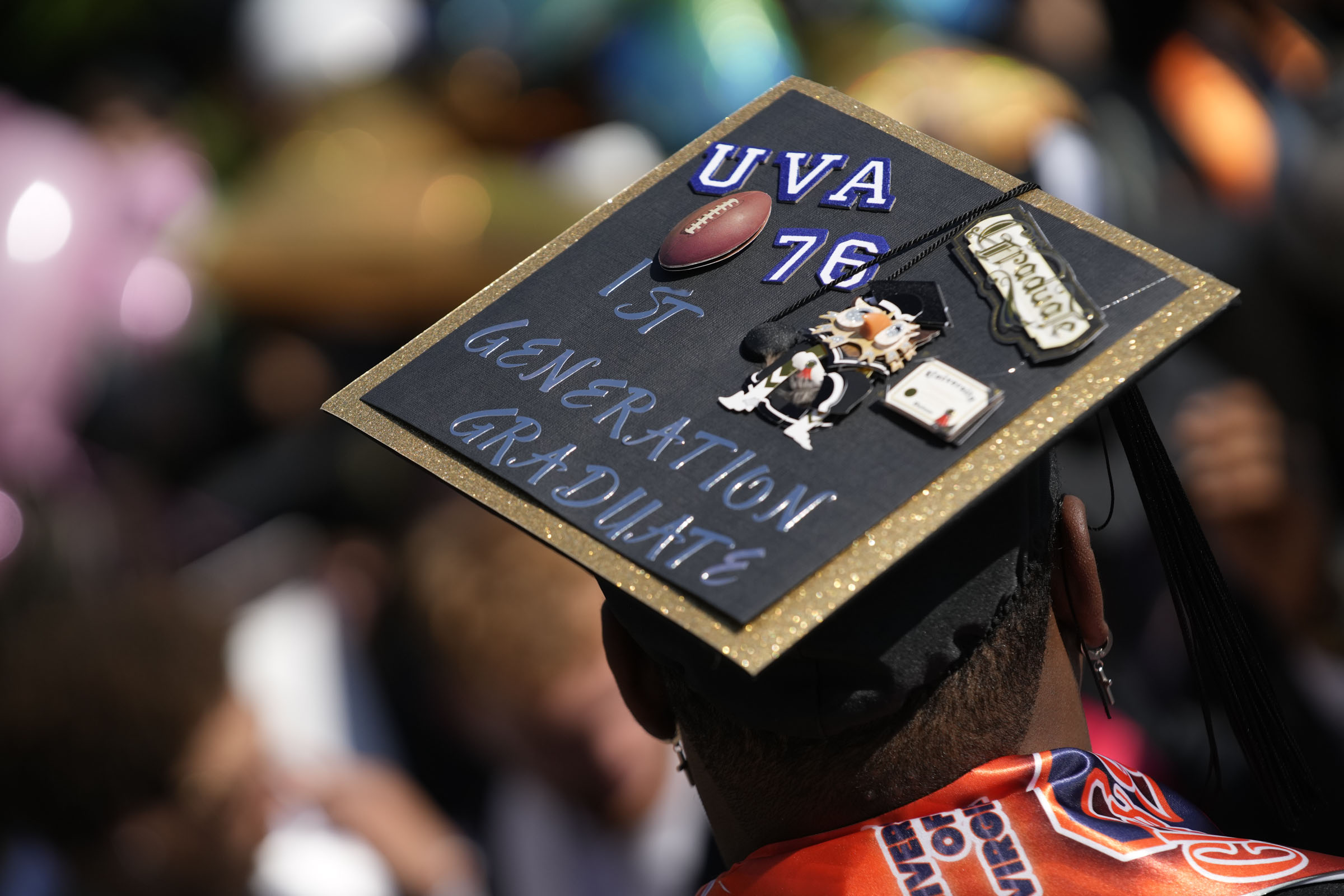 A student’s mortar board is decorated to show he is a first-generation graduate.