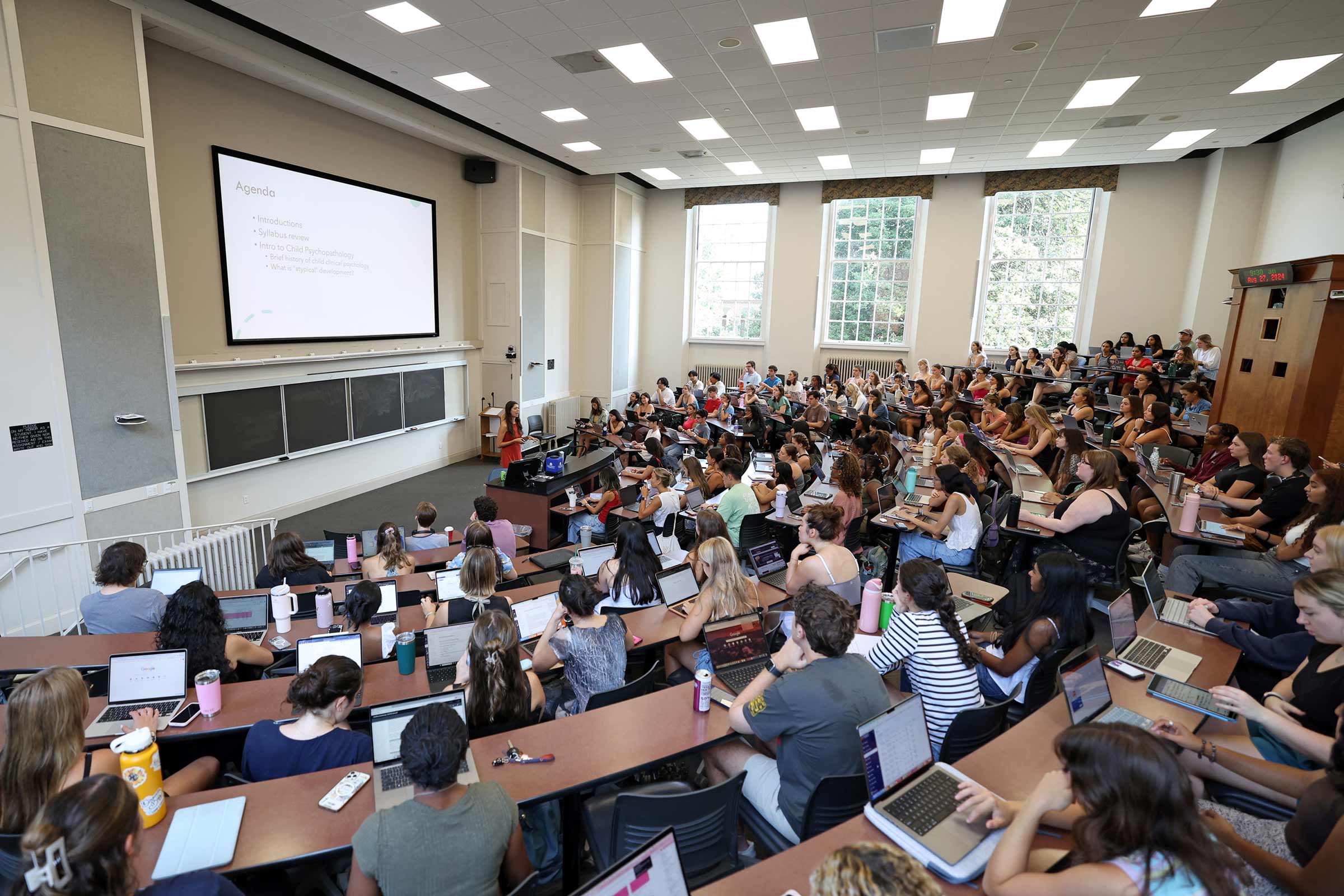 Portrait of a large number of students in a classroom.