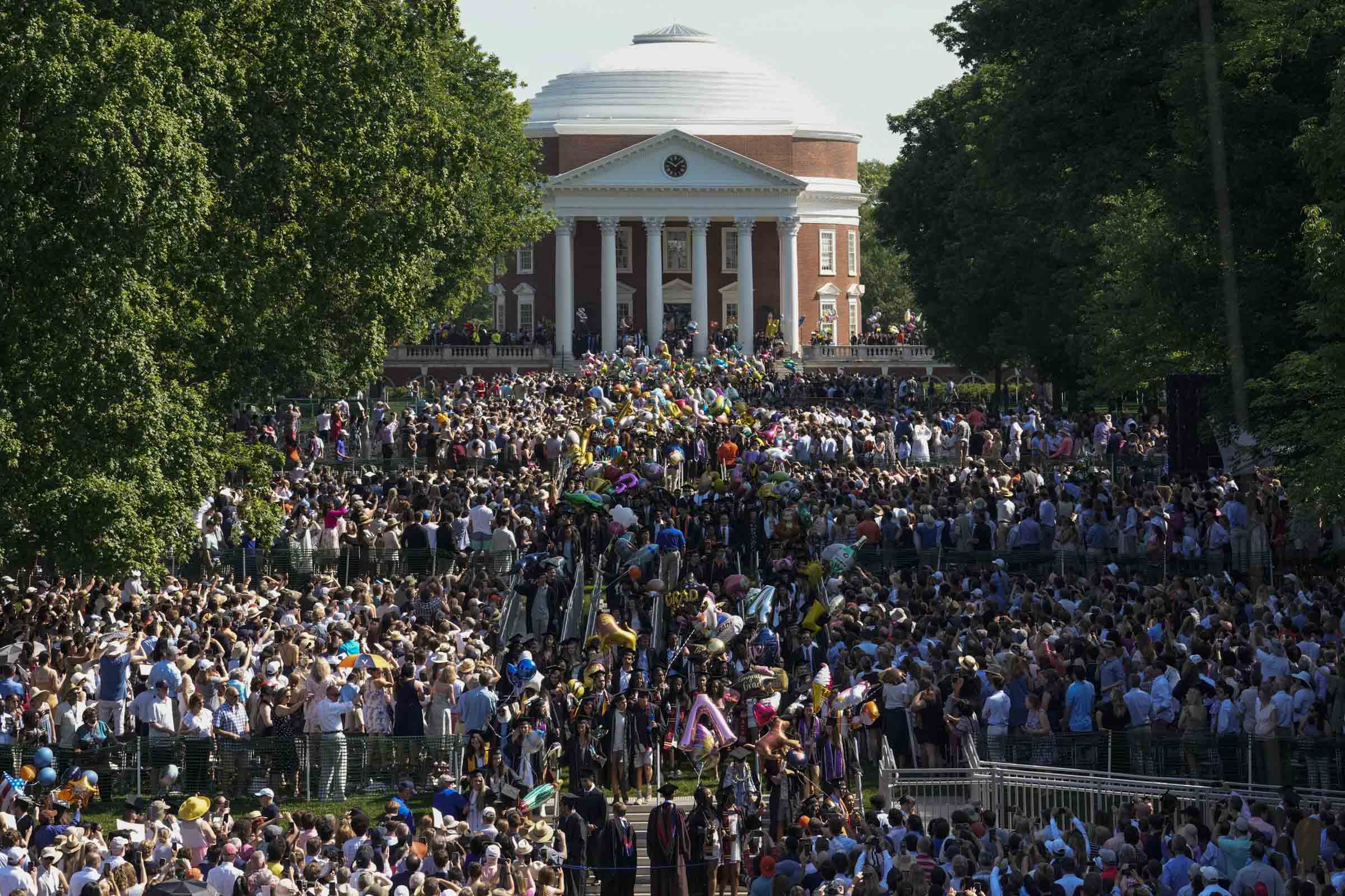 Thousands of graduates and spectators fill the Lawn in front of the Rotunda.