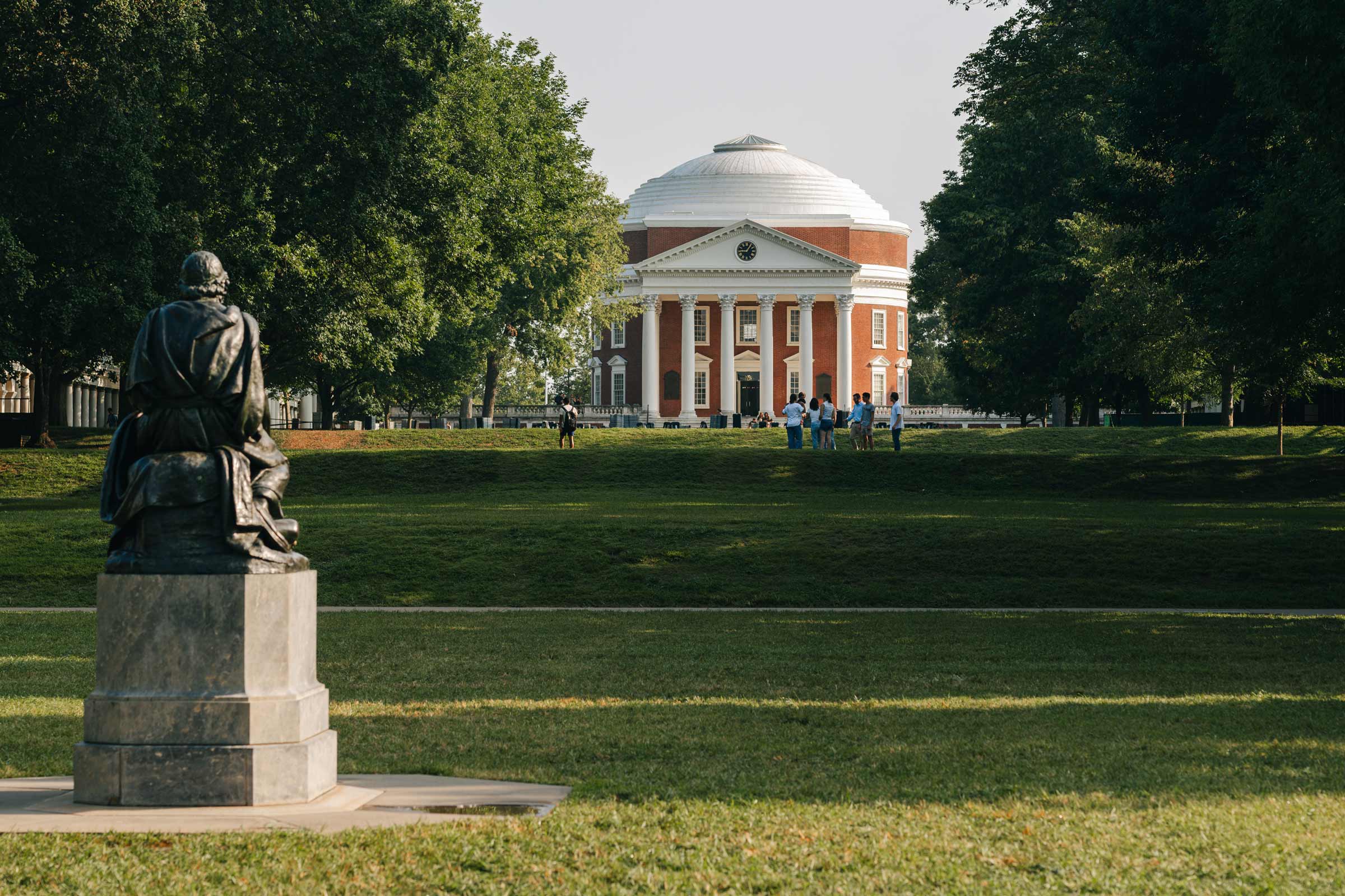 Portrait of UVA Lawn with a distant view of the Rotunda.