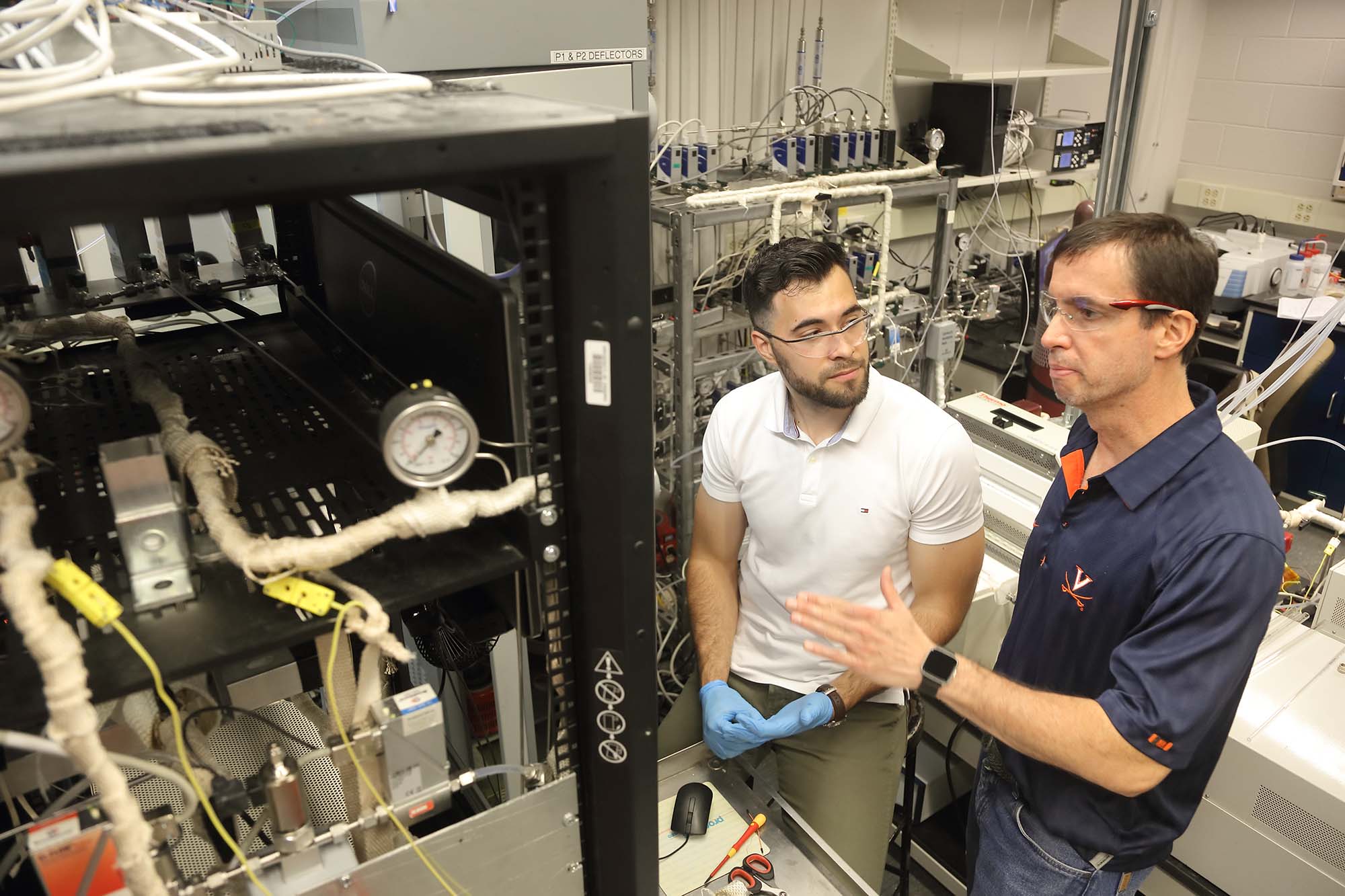 Carlos Weiler, left, William Epling, right running an experiment together