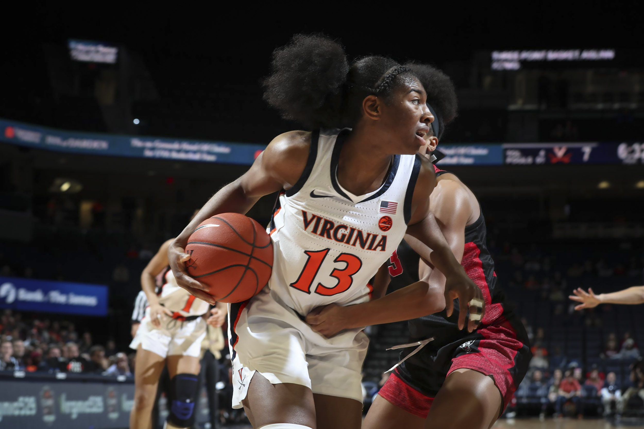 UVA womens Basketball player protecting the ball