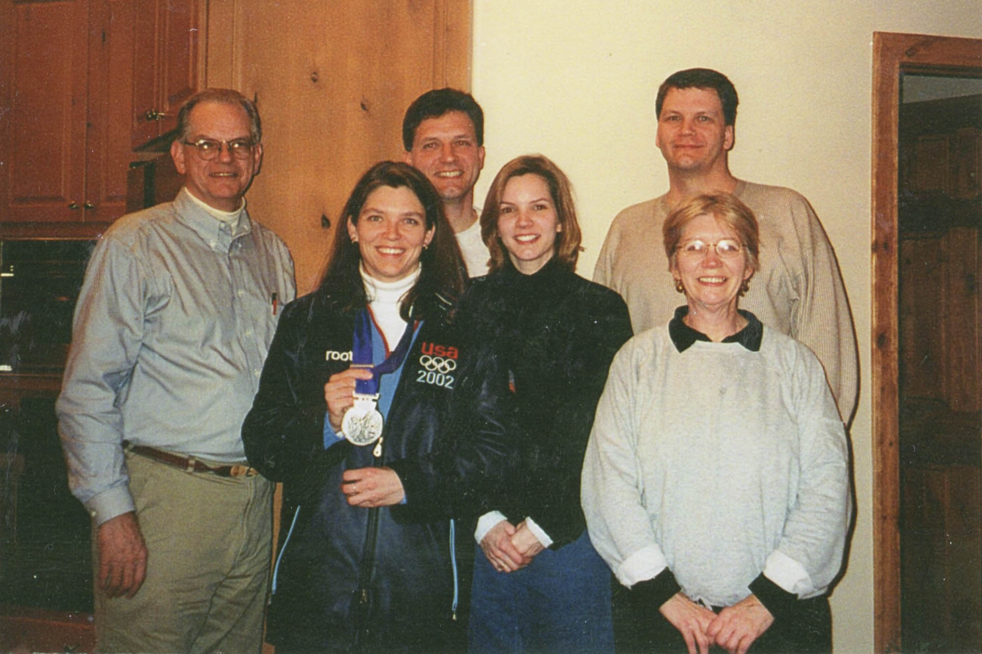 Parsley-Davenport with her family and silver medal for a photo 