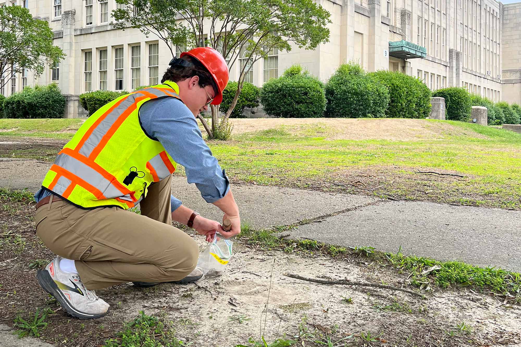 Truong taking a sample in the field.