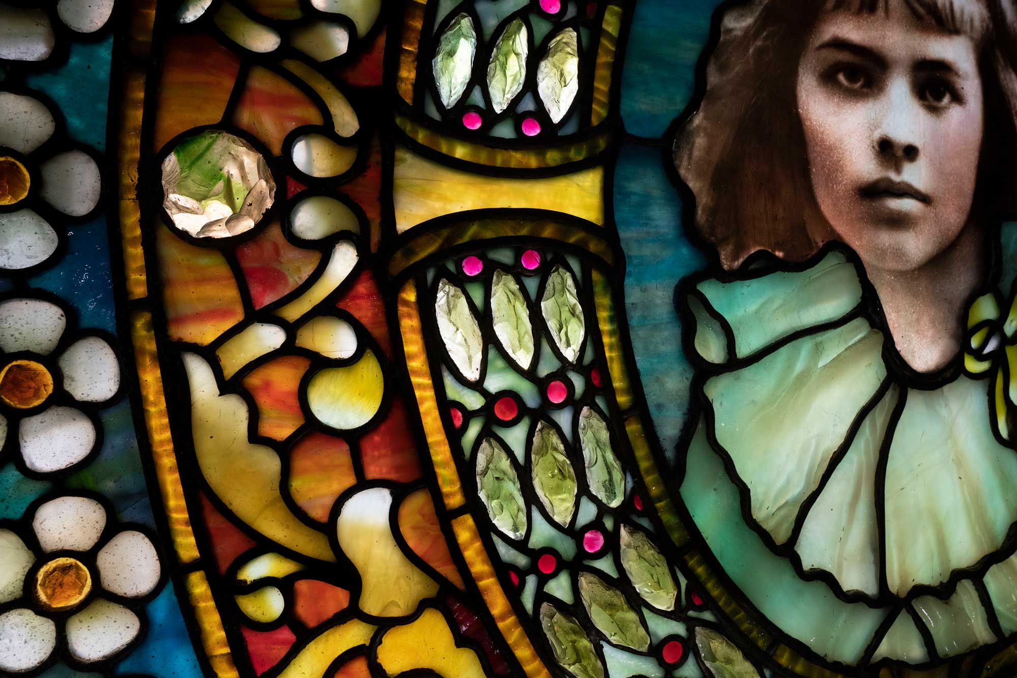 Close up image of the Tiffany window that has Eugenie Moore Faulkner in it