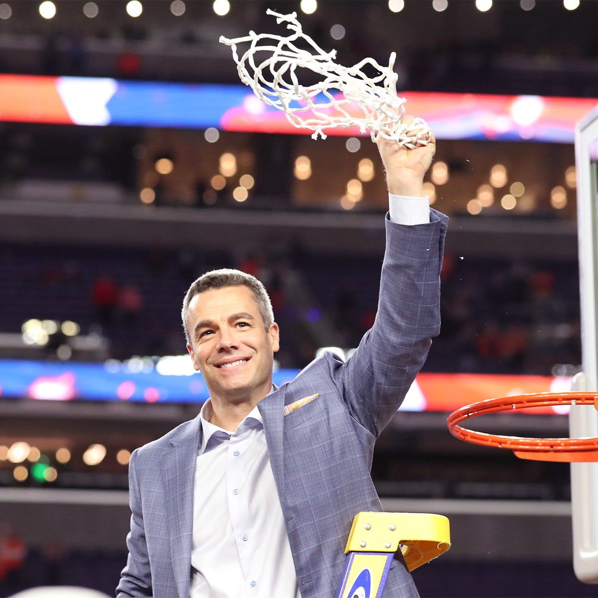 Tony Bennett waving the game wining net right after he cut it off.