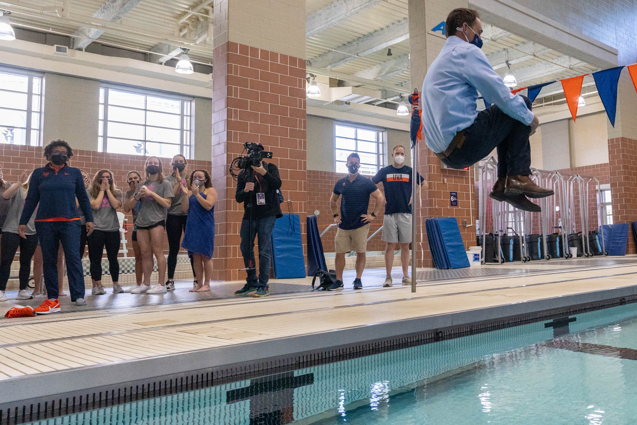 President Jim Ryan Jumping into a swimming pool