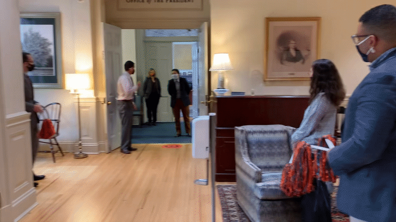 People standing in the presidents office